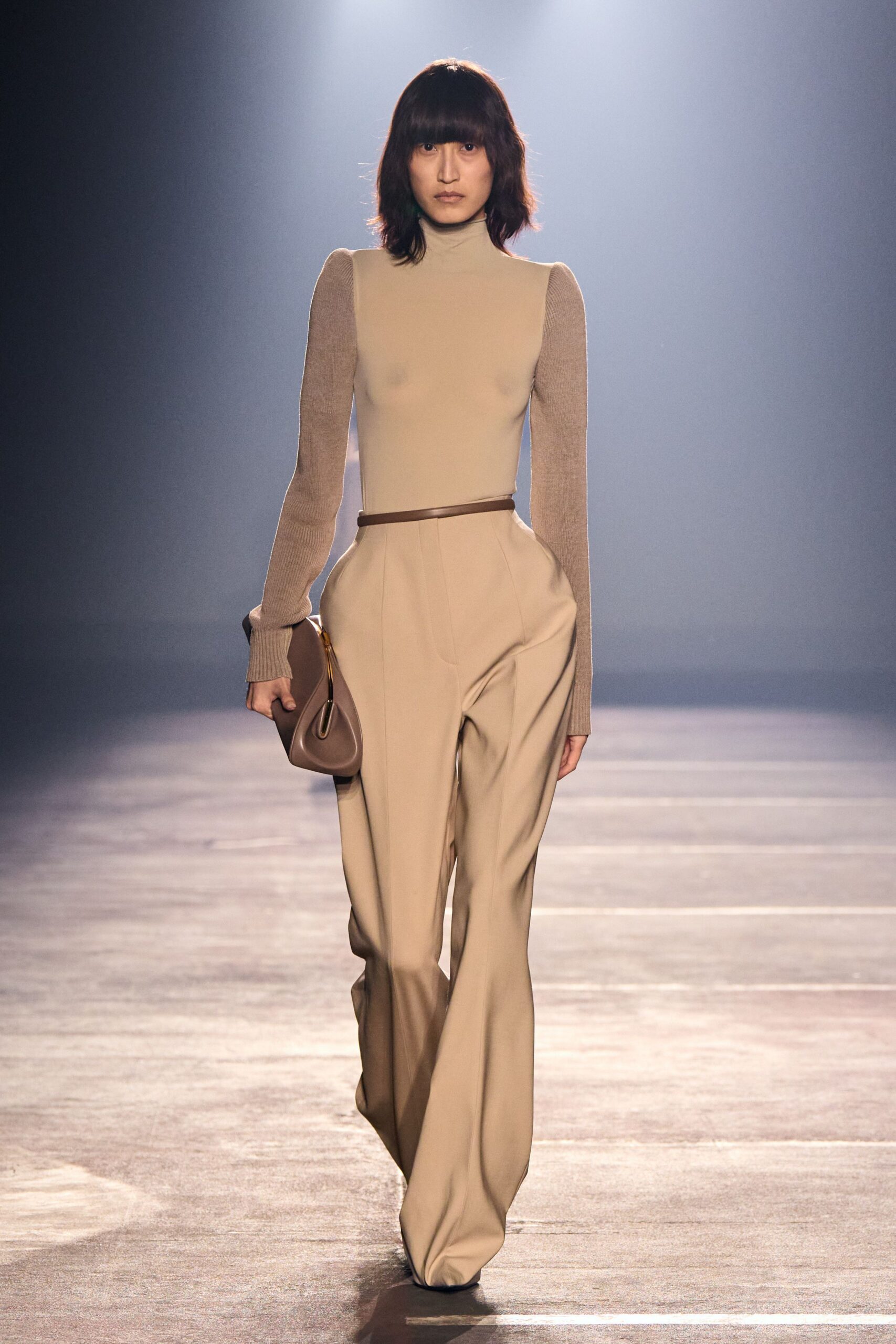 beige fitted top and tailored pants