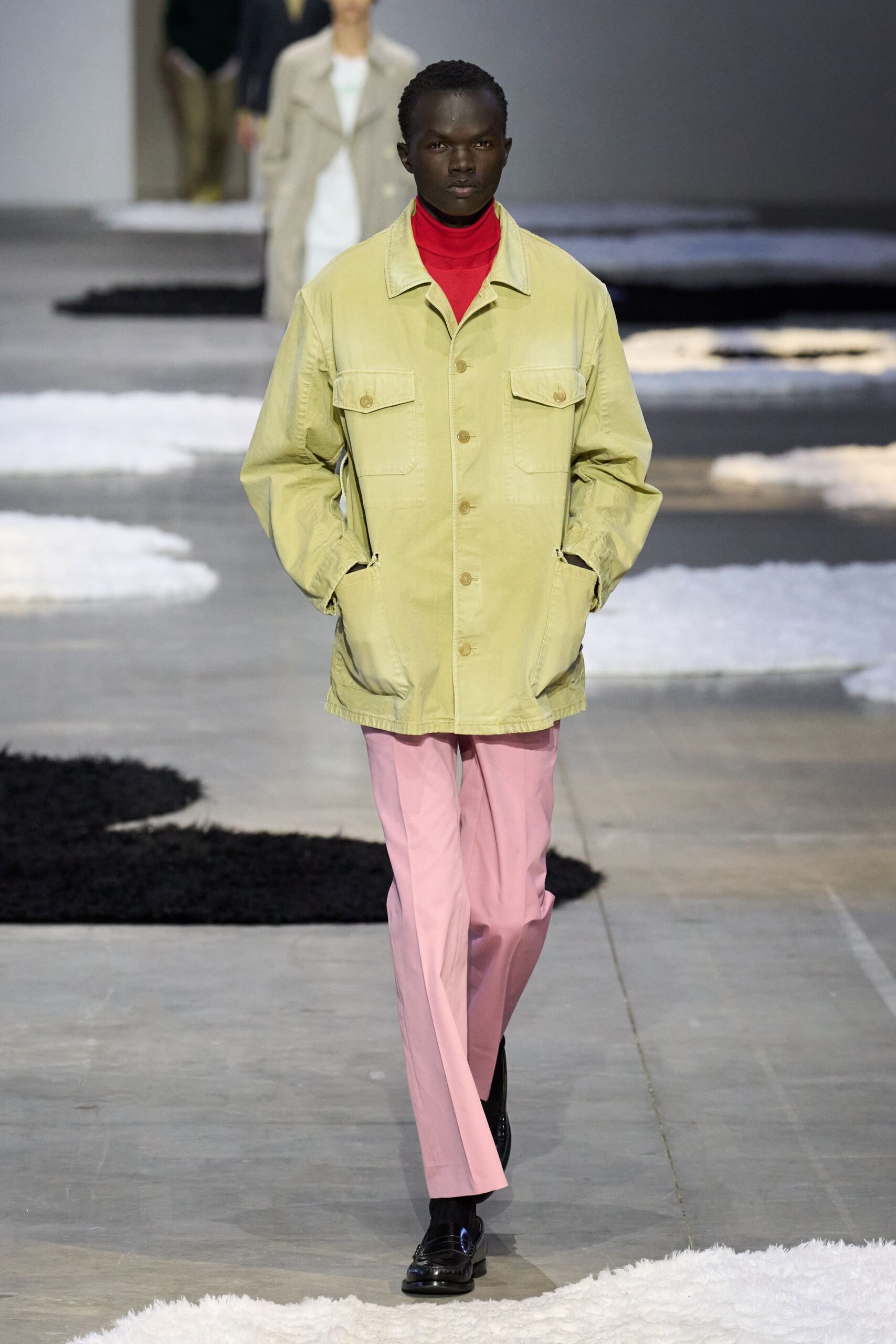 green jacket red turtleneck pink pants