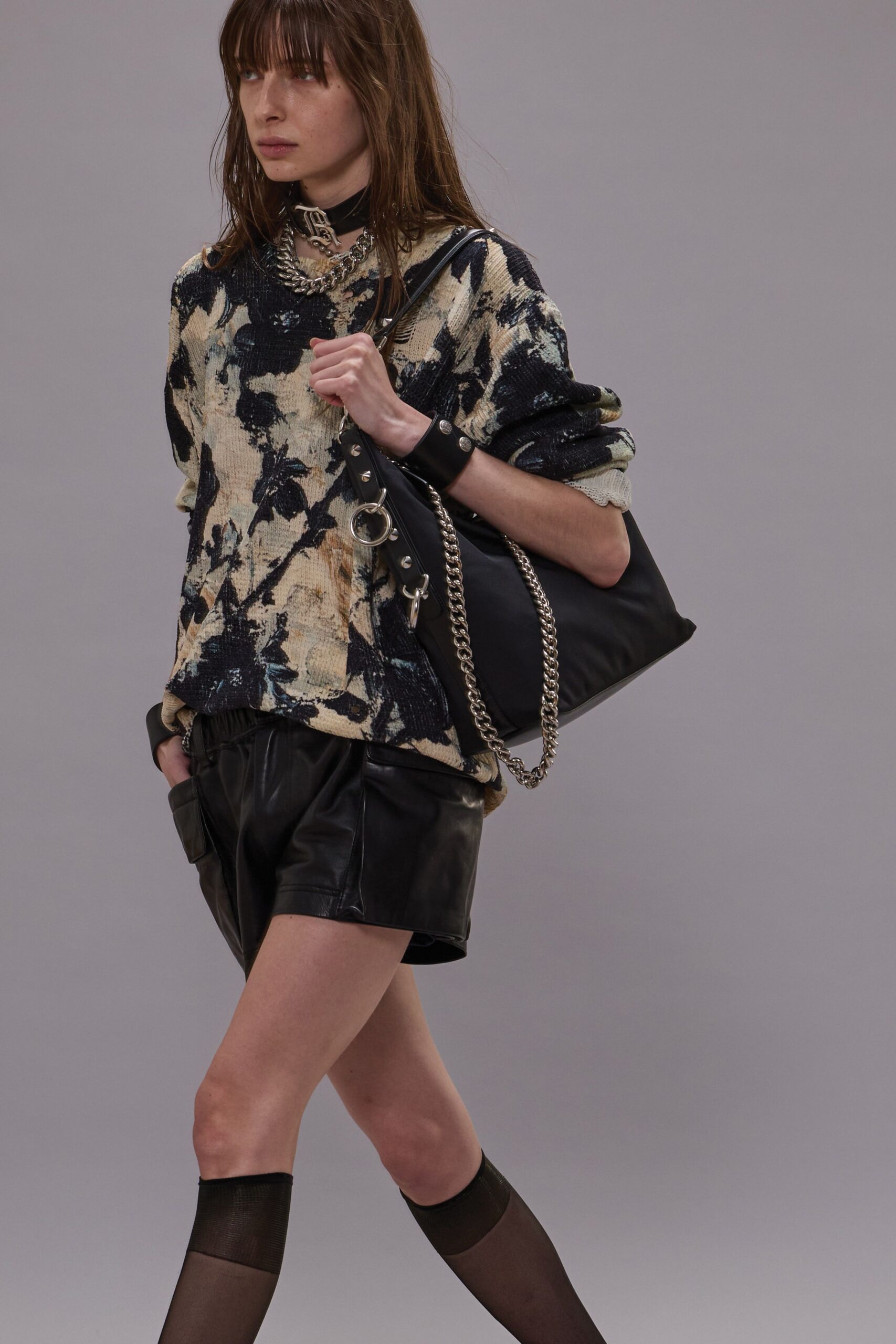 relaxed printed sweater with leather shorts
