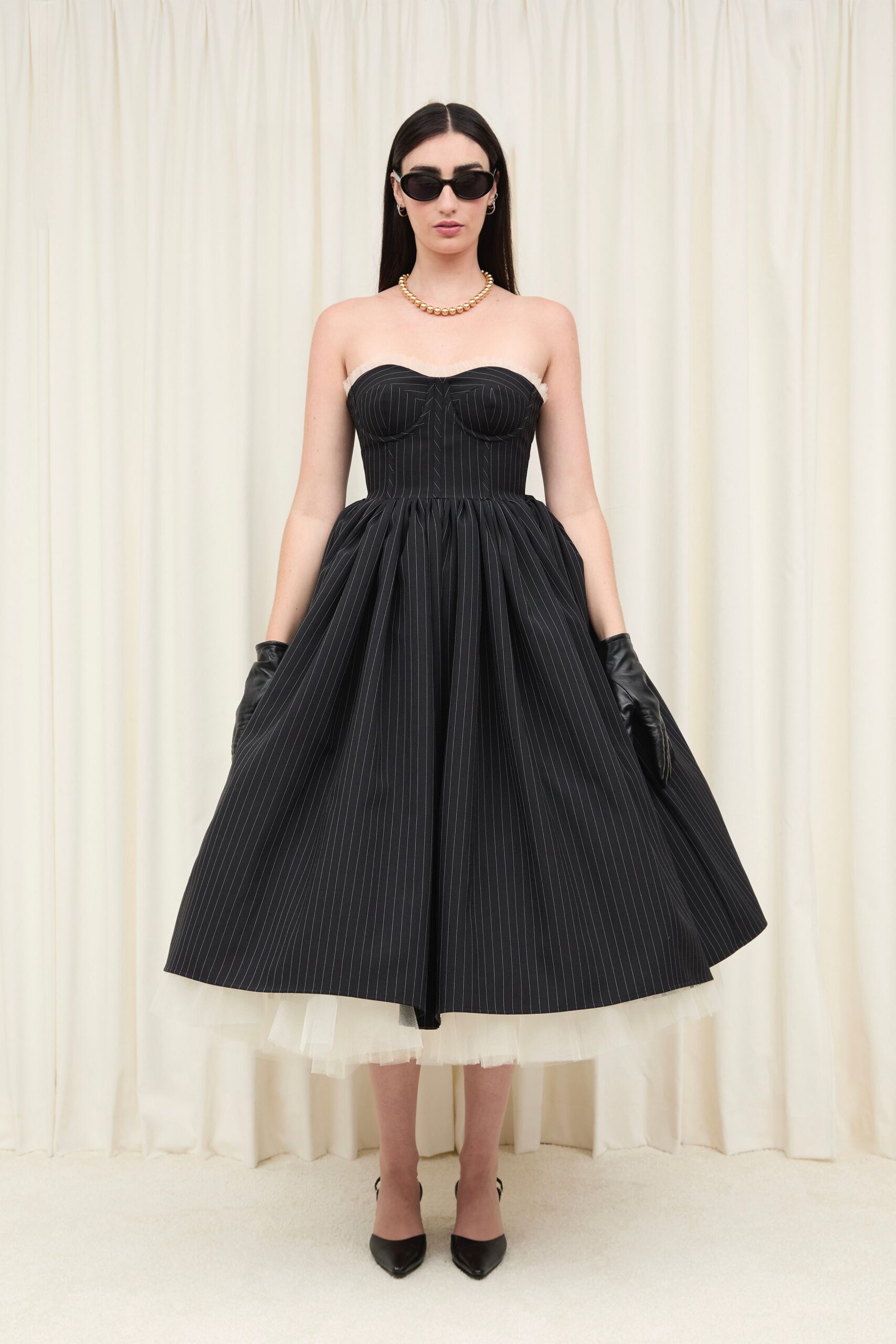black cotton strapless fitted pleated midi dress