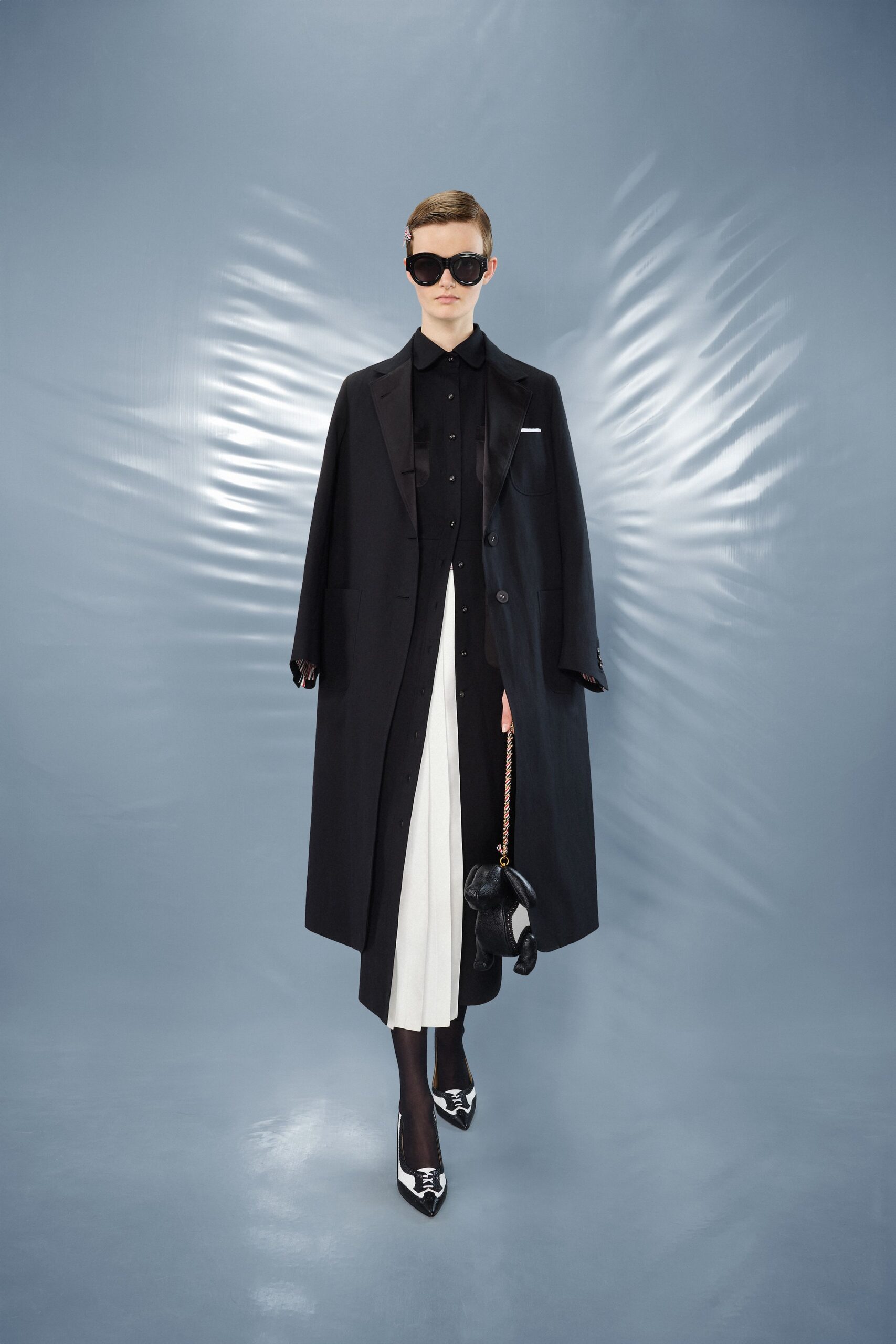 black wool coat with pleated skirt