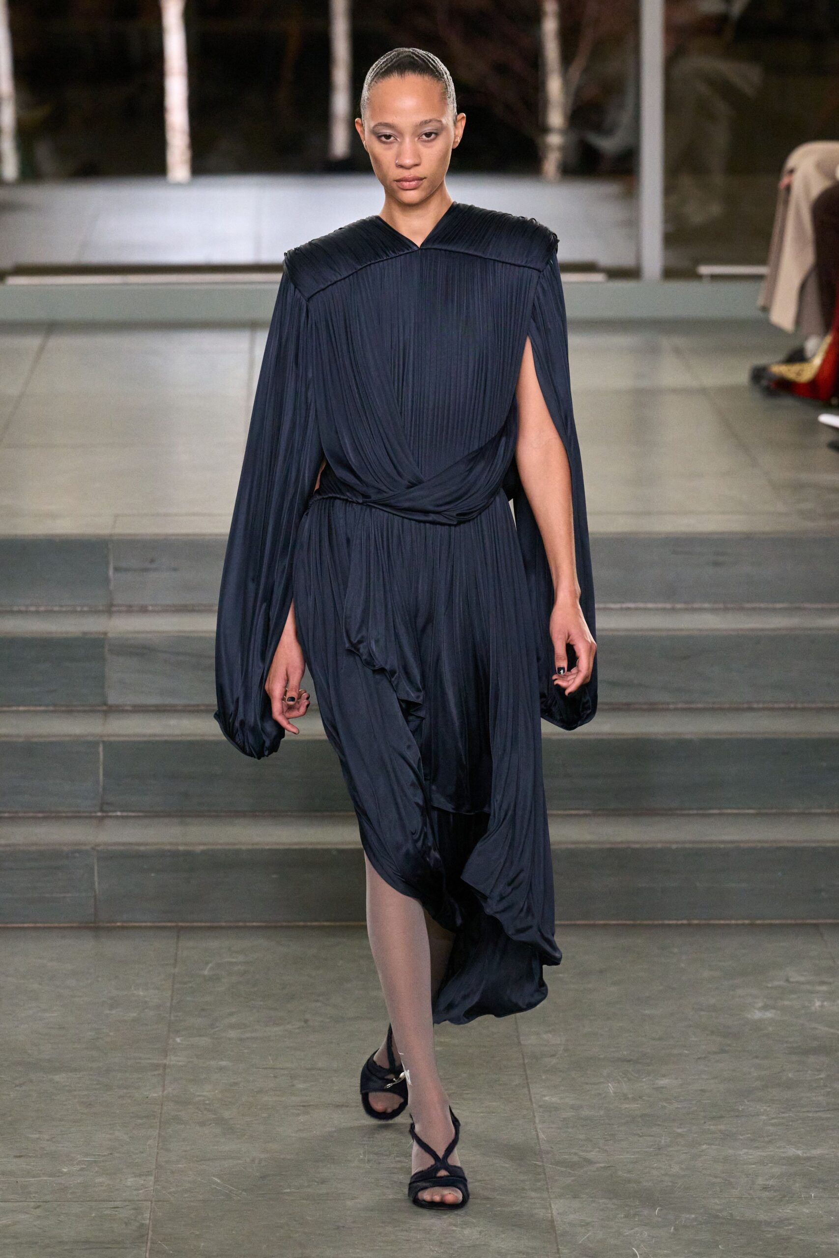 navy pleated midi dress with strappy shoes