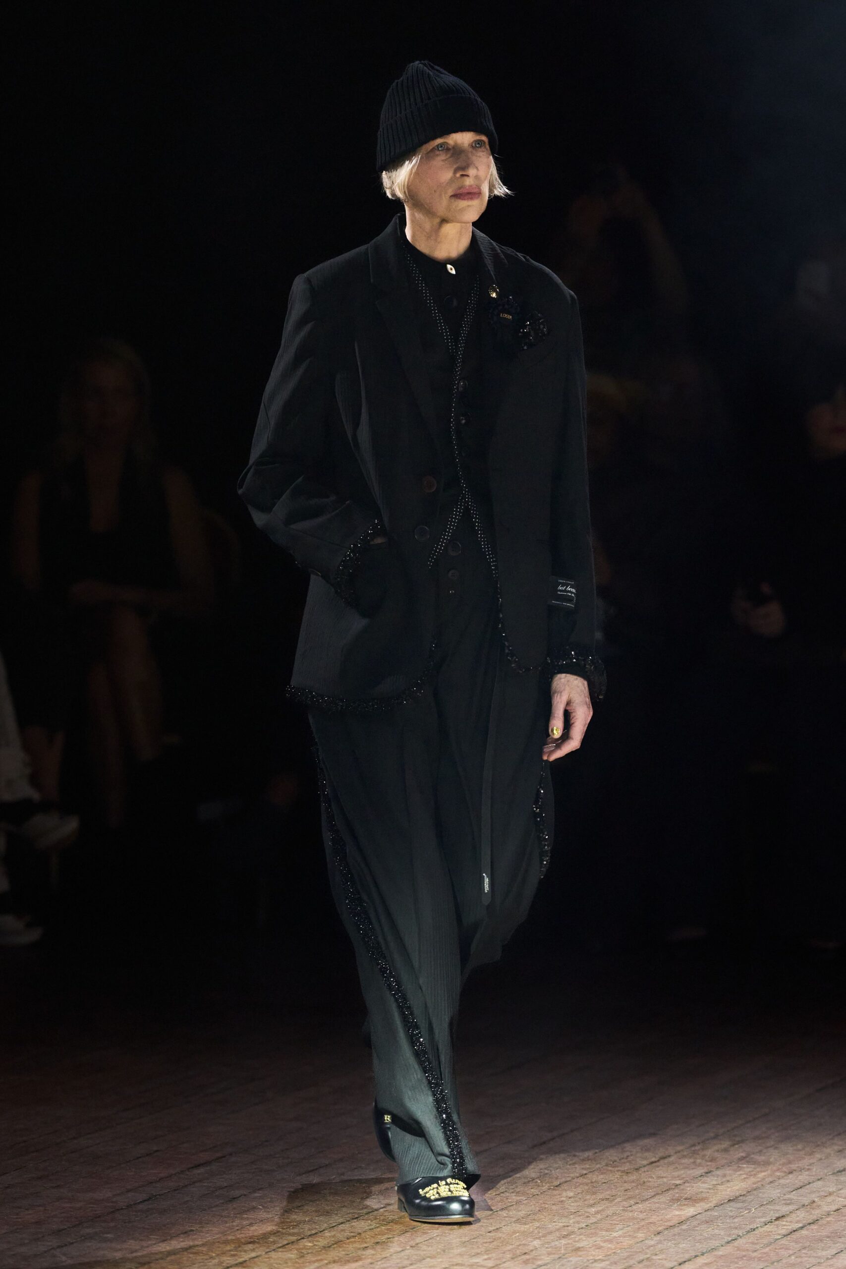 black tailored suit with knit hat
