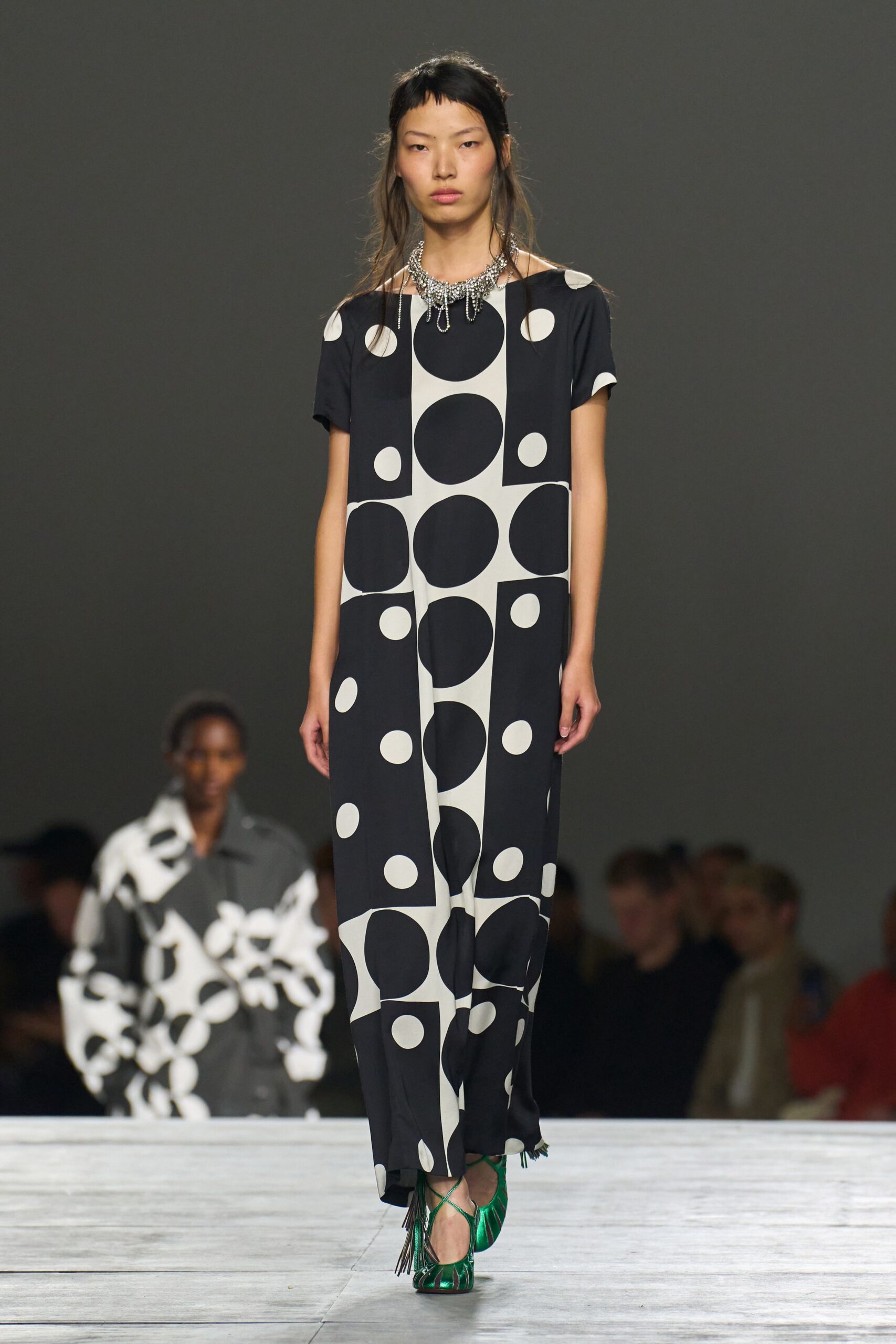 black and white printed jumpsuit with green shoes