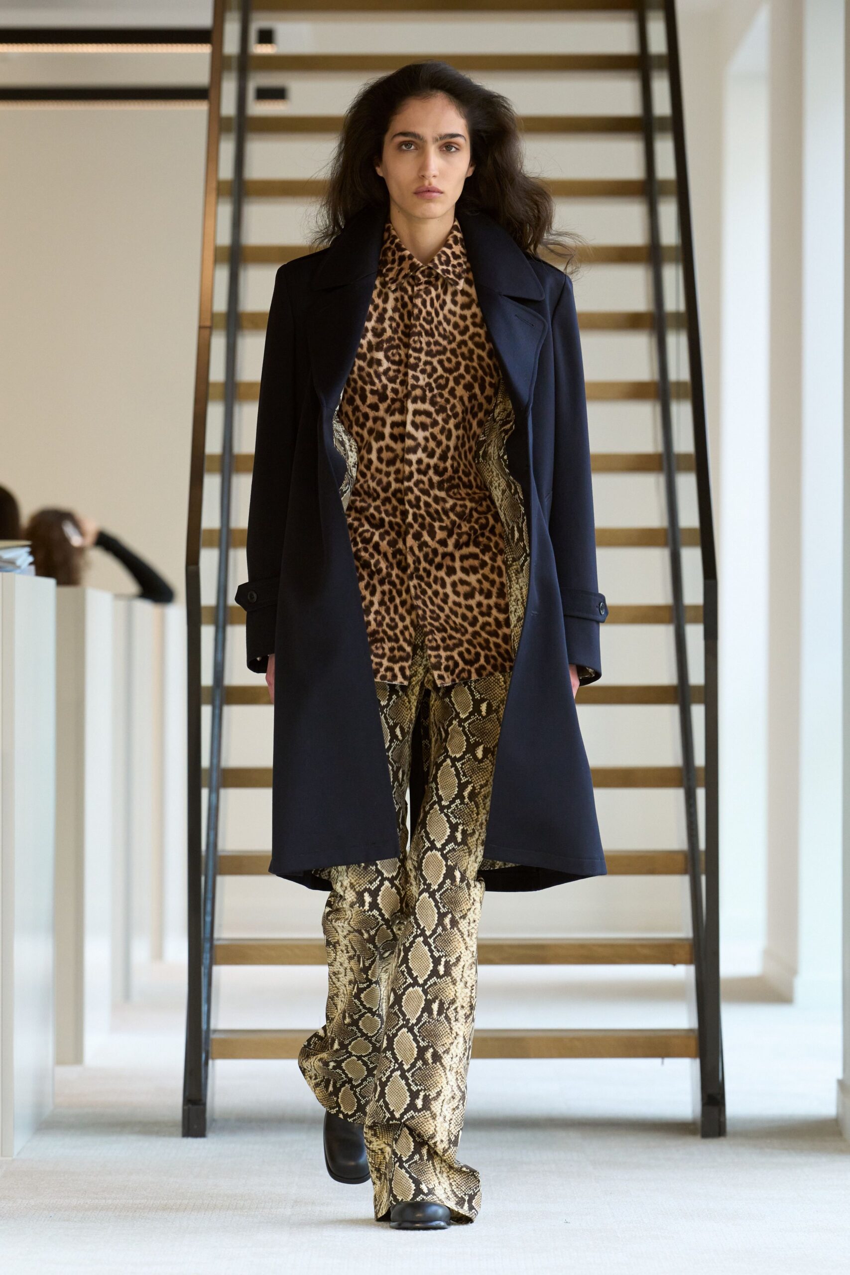 black coat with animal-print shirt