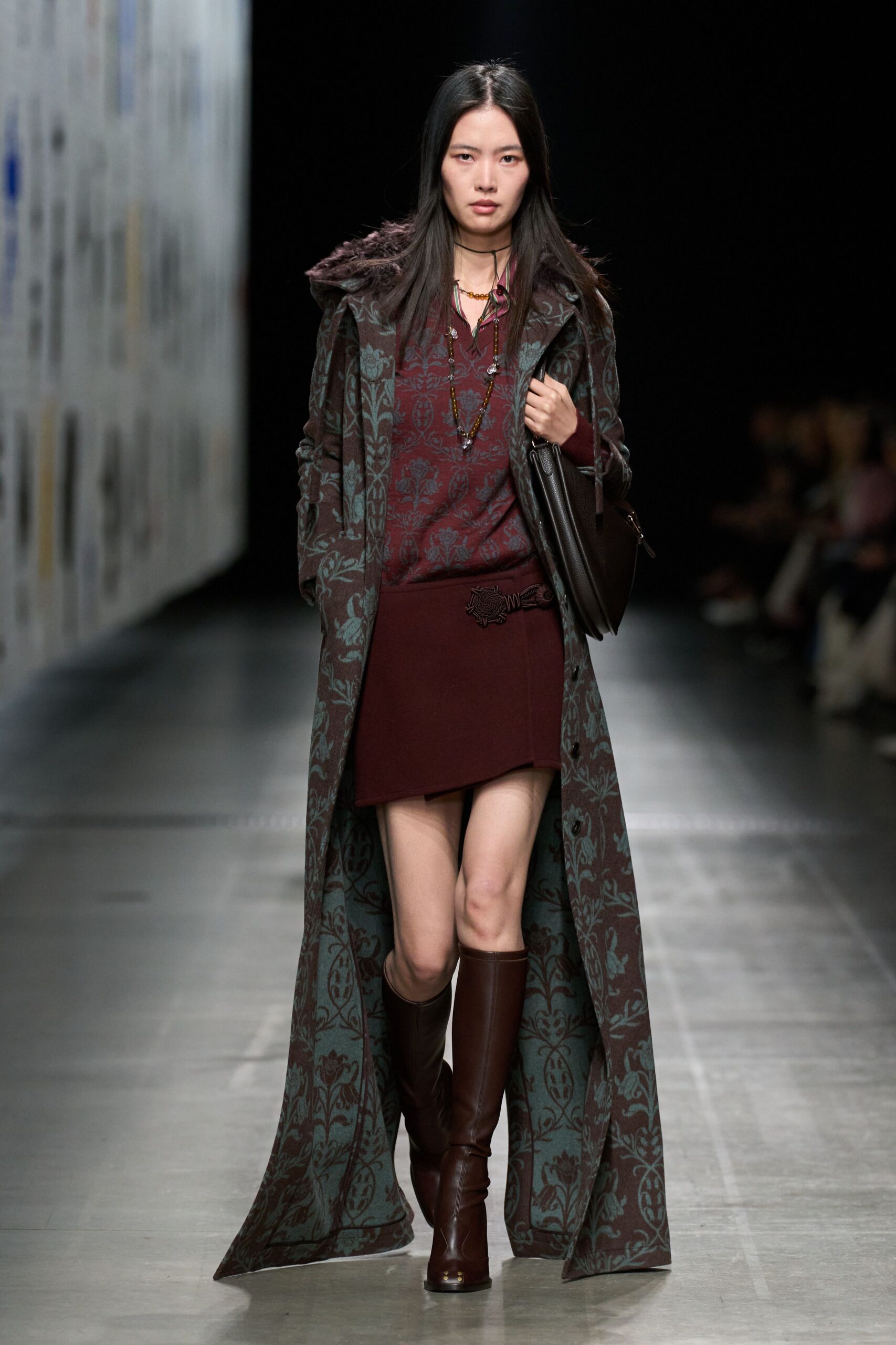 green embroidered coat with brown skirt