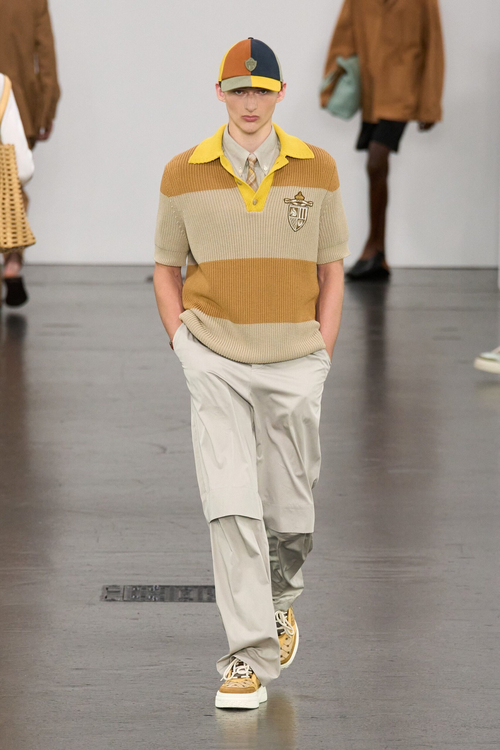 beige striped top with gray pants