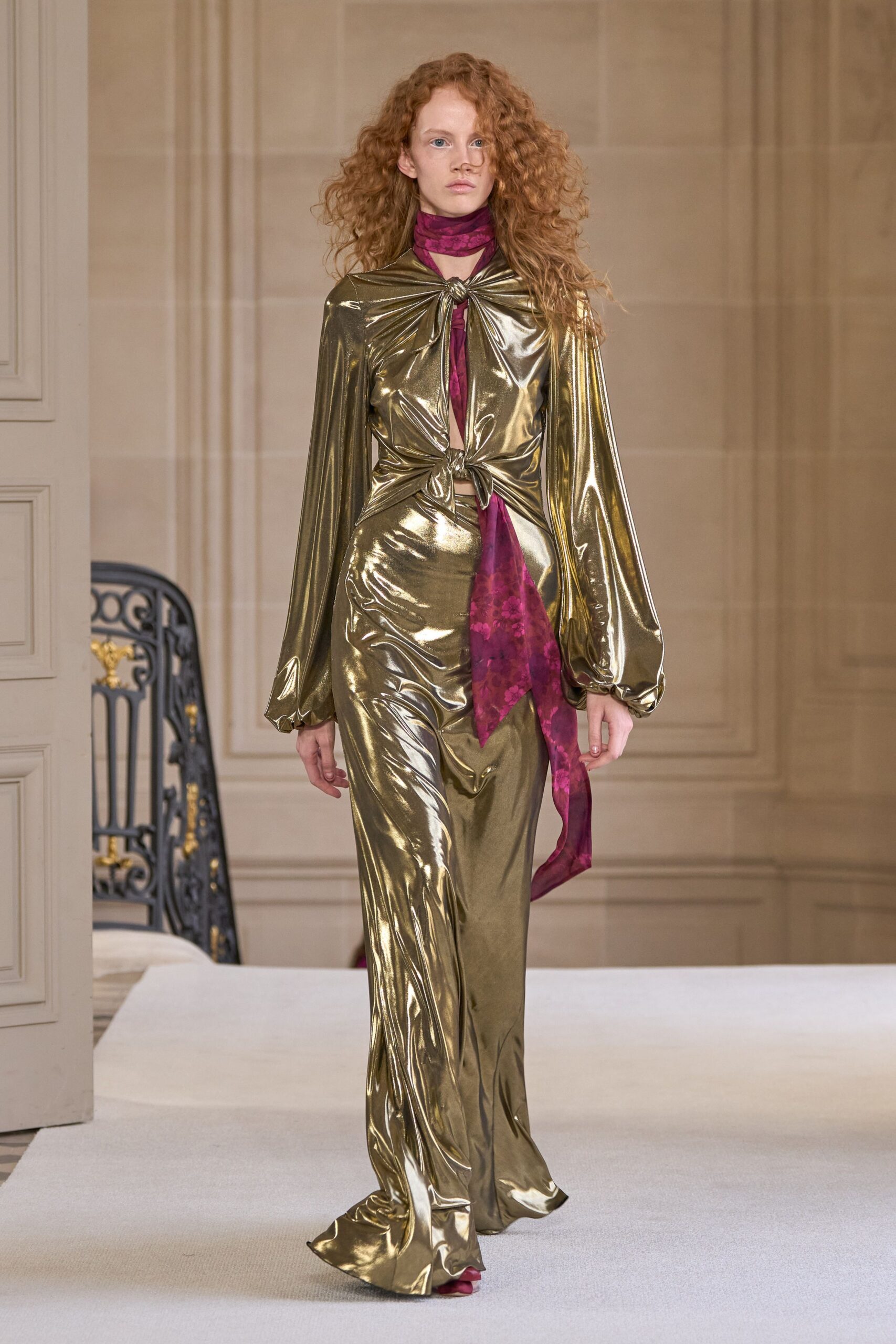 gold metallic long-sleeve v-neck fitted draped shiny gown