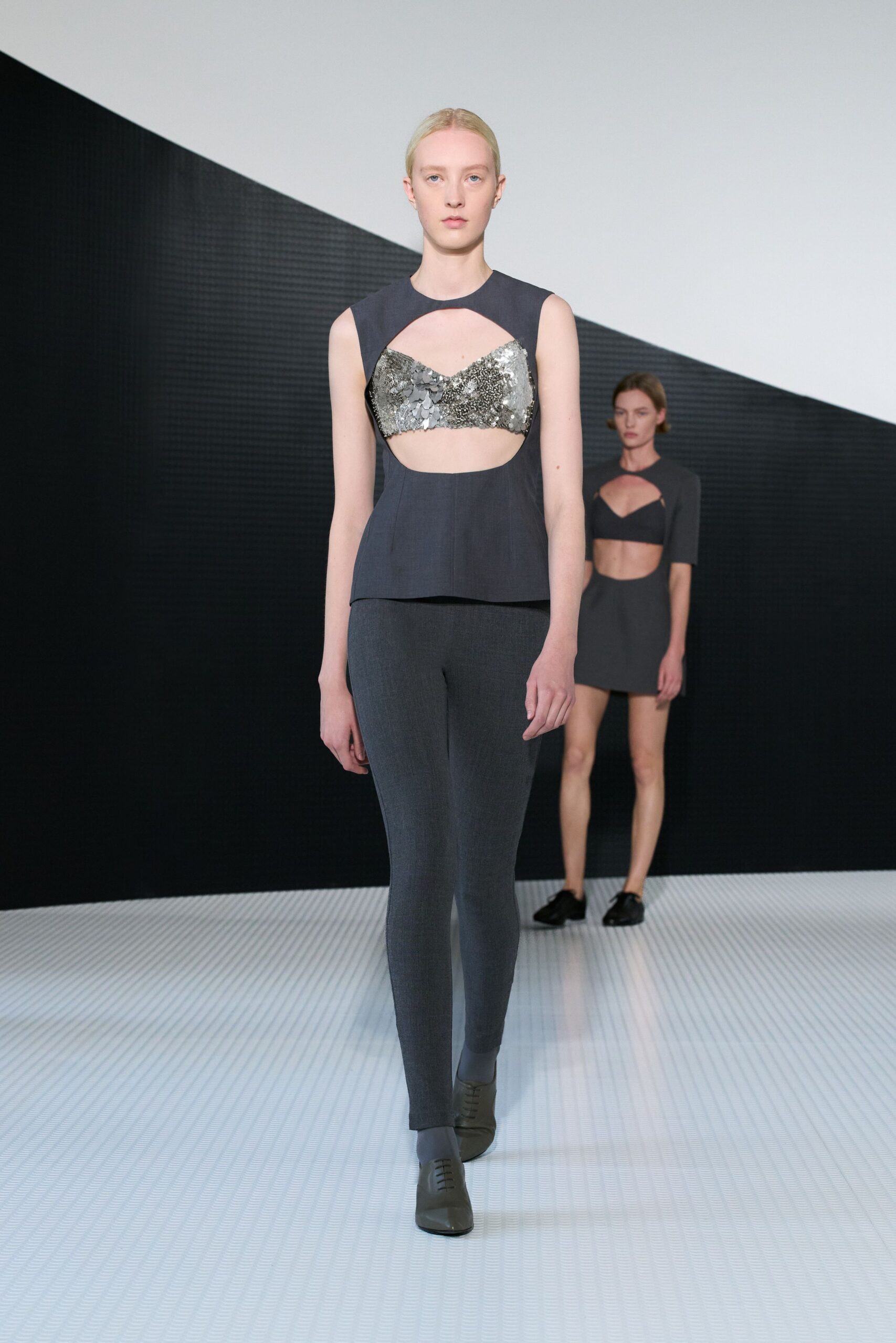 black fitted top and gray pants