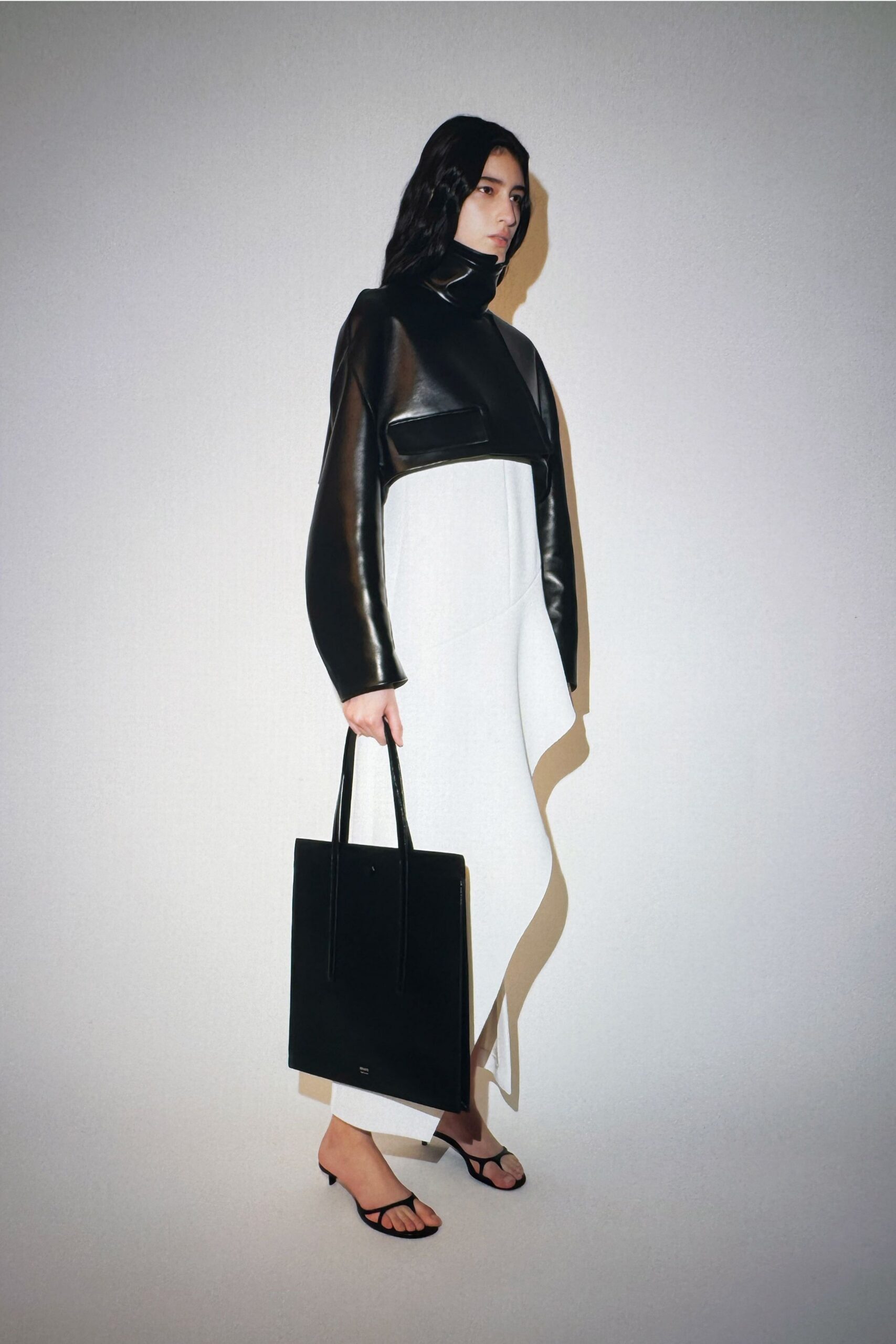 black leather jacket white asymmetric dress