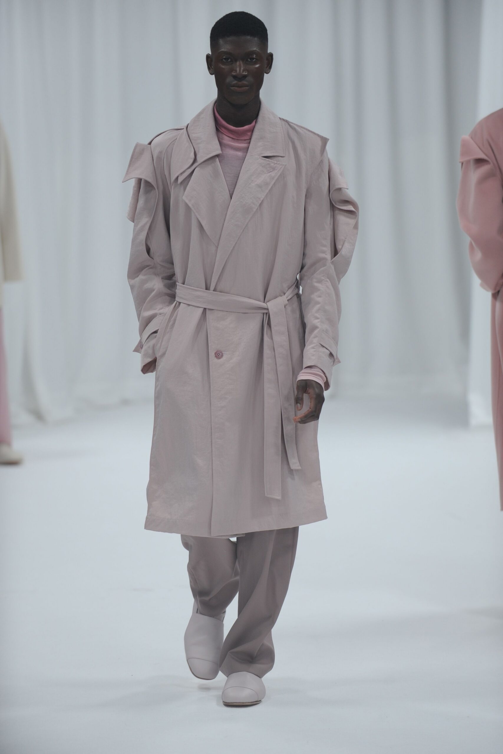 pink trench coat with tailored pants