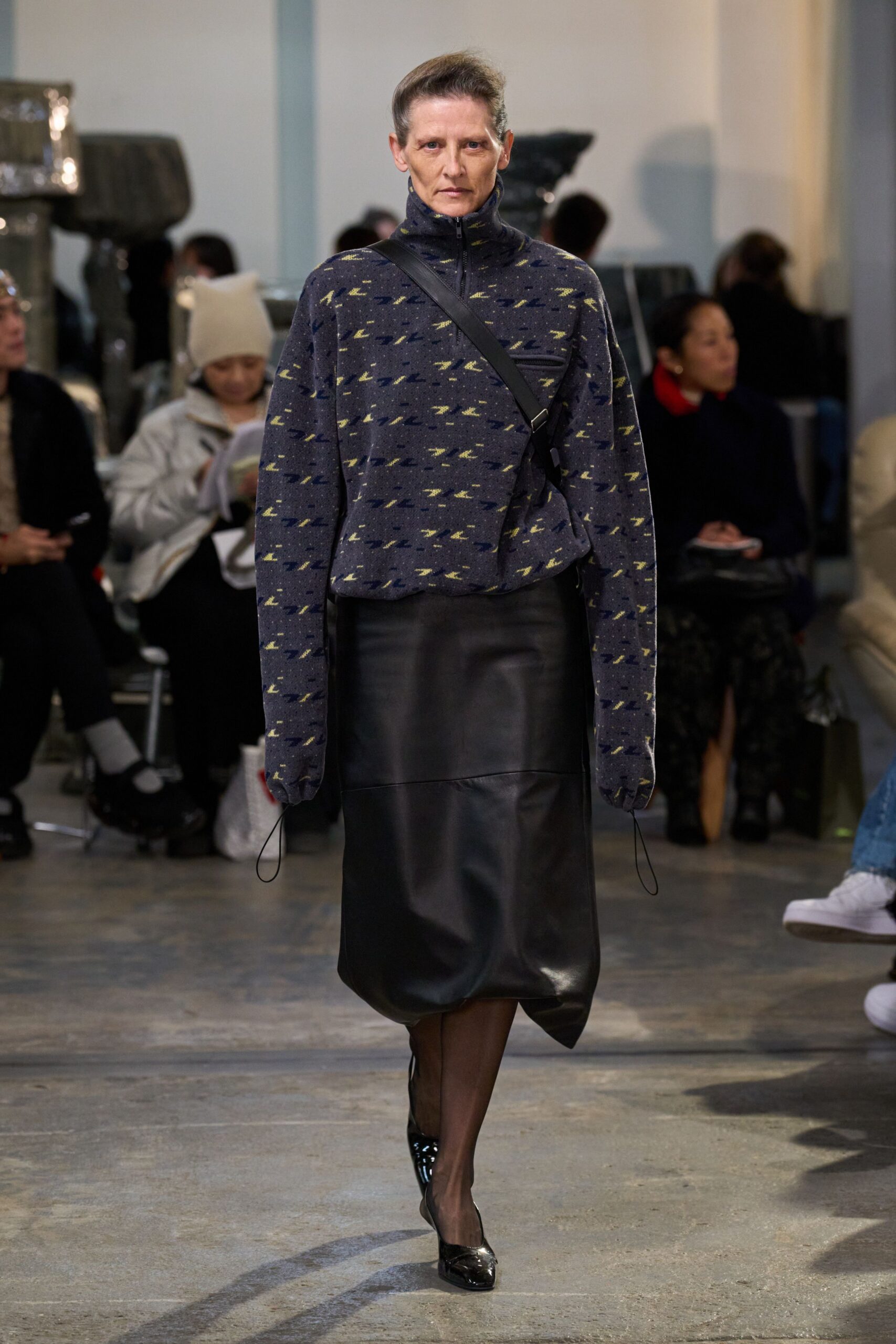 blue printed relaxed top with black leather skirt