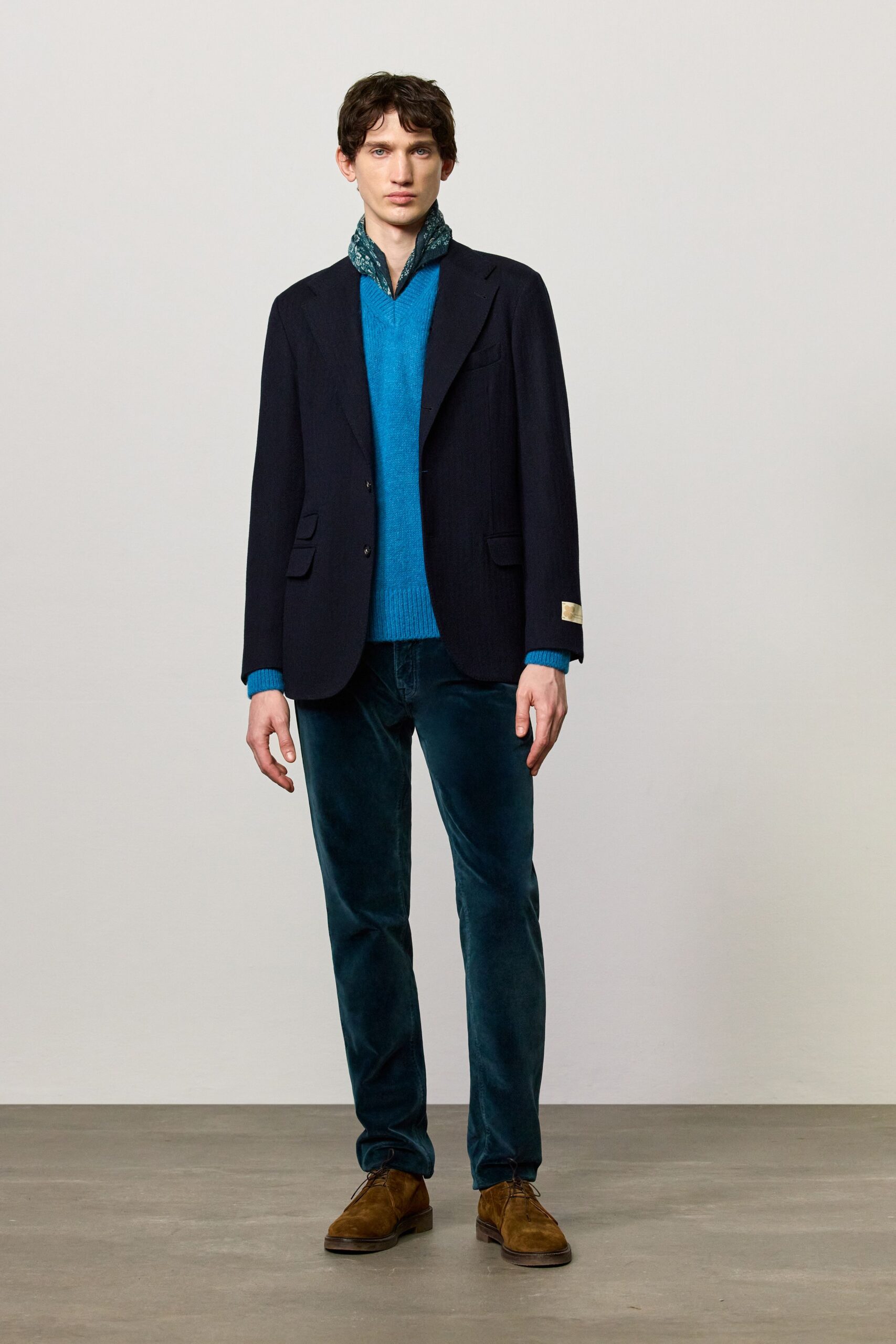 black blazer blue sweater teal pants