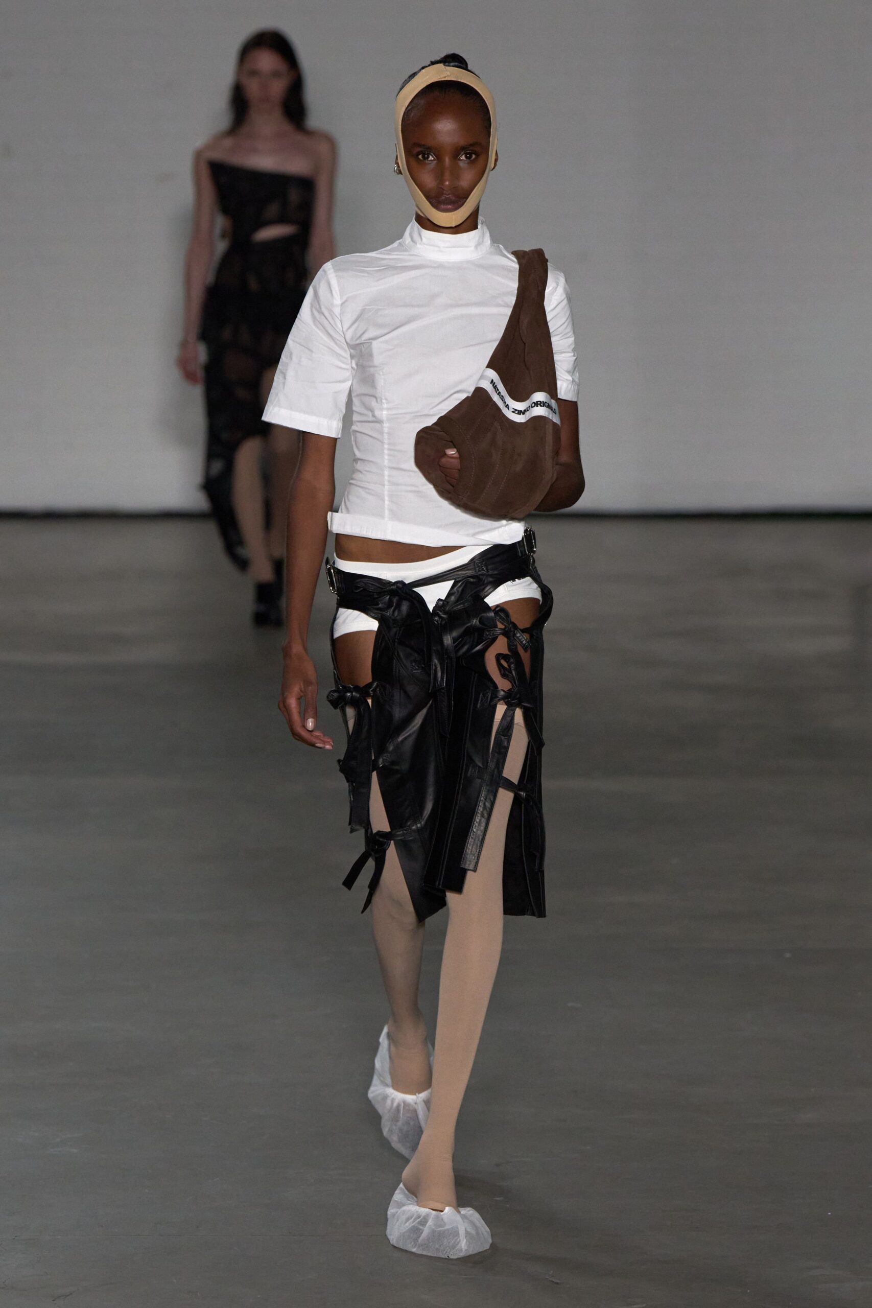 white fitted top with black skirt