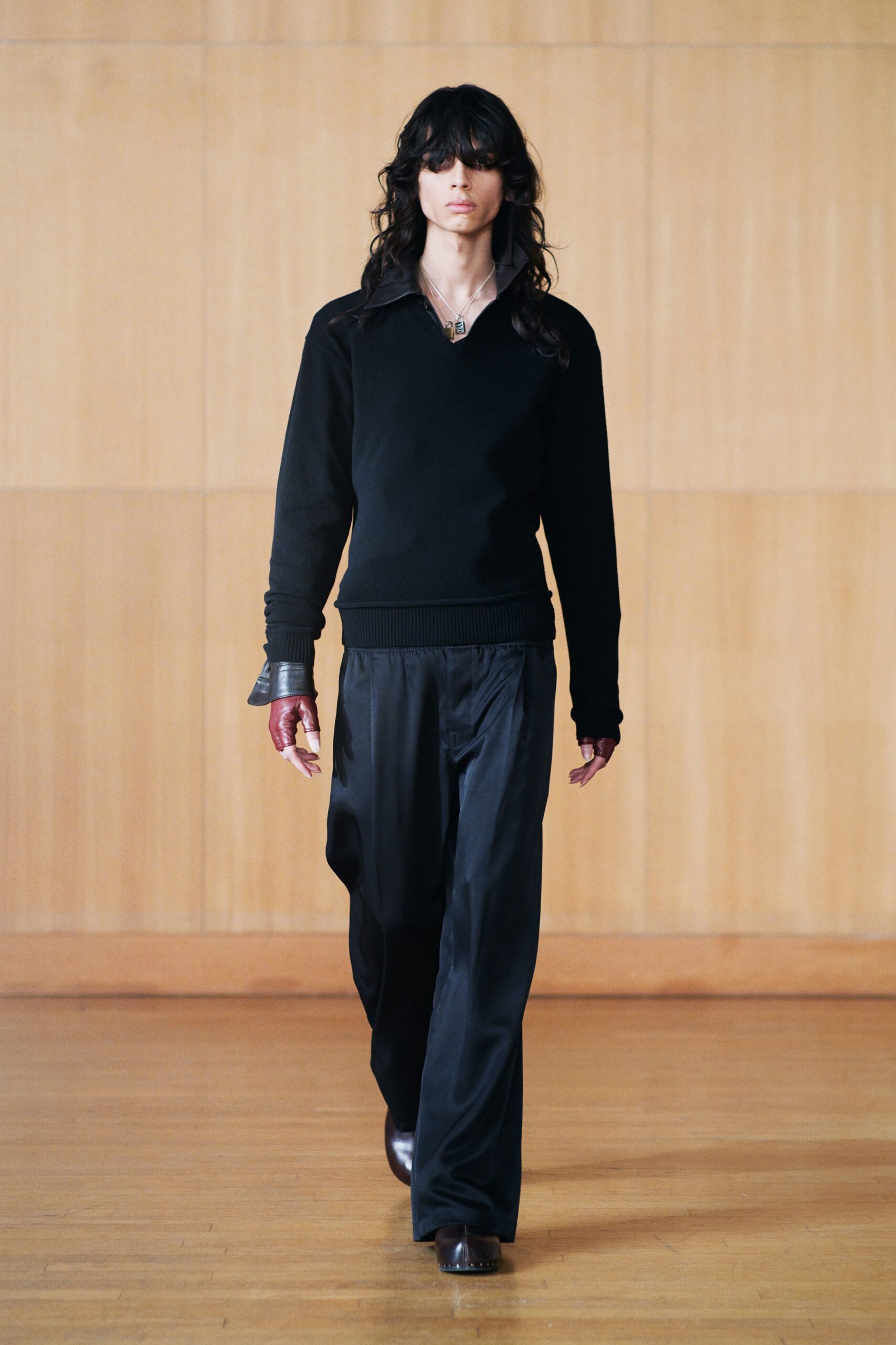 black wool sweater and relaxed pants