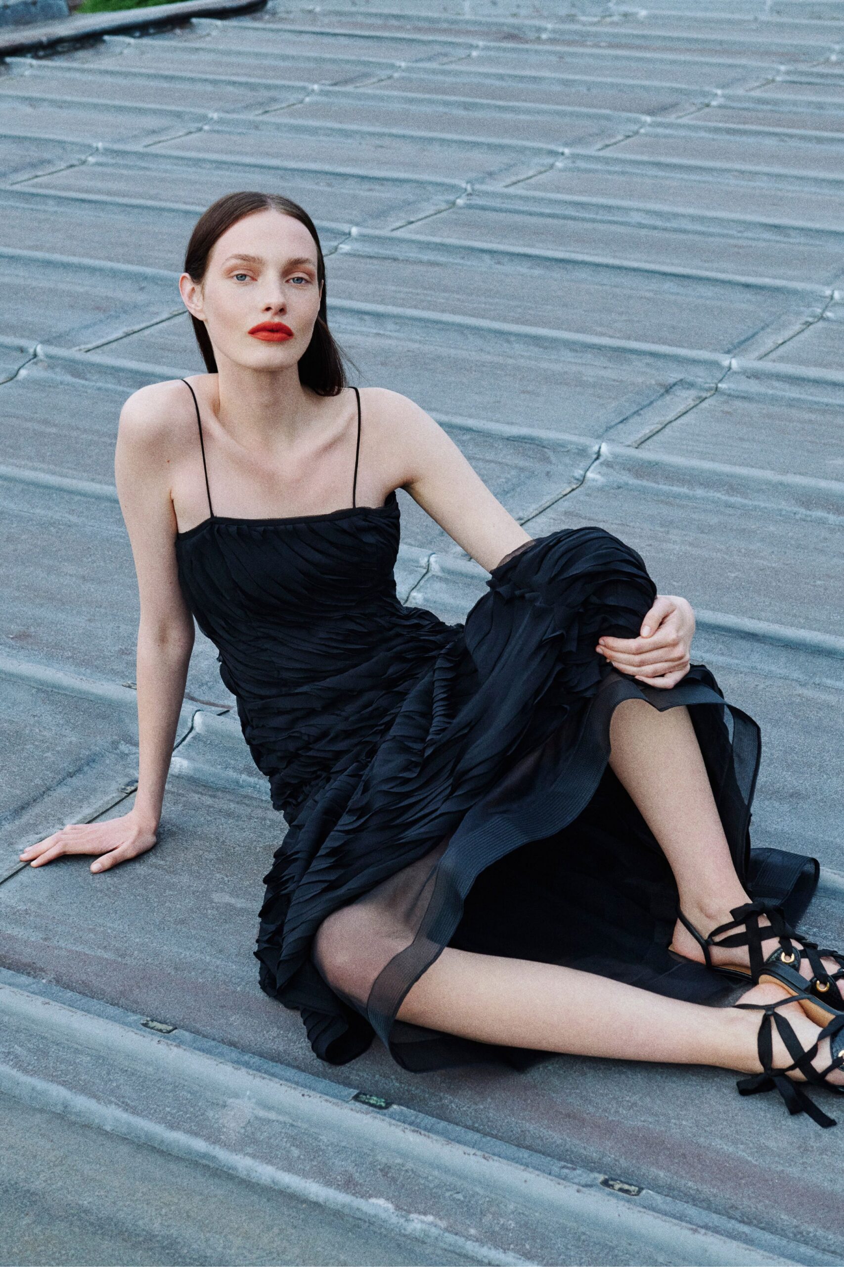black ruffled midi dress with strappy shoes