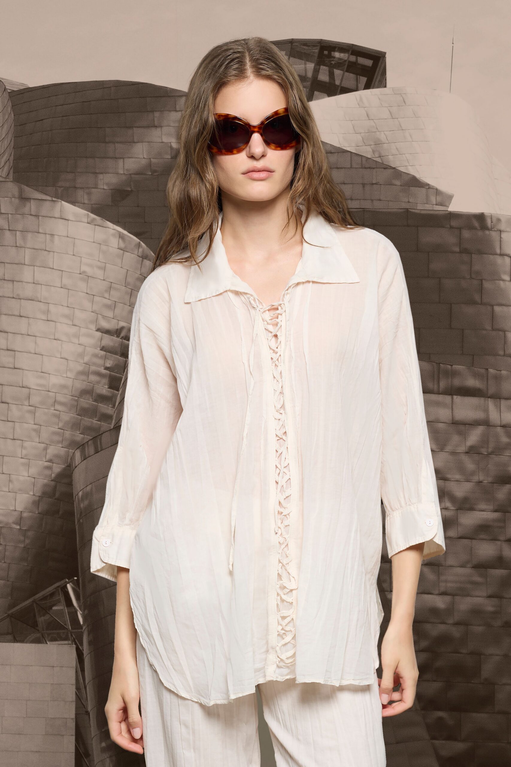 white silk long-sleeve collared relaxed buttoned pleated shirt