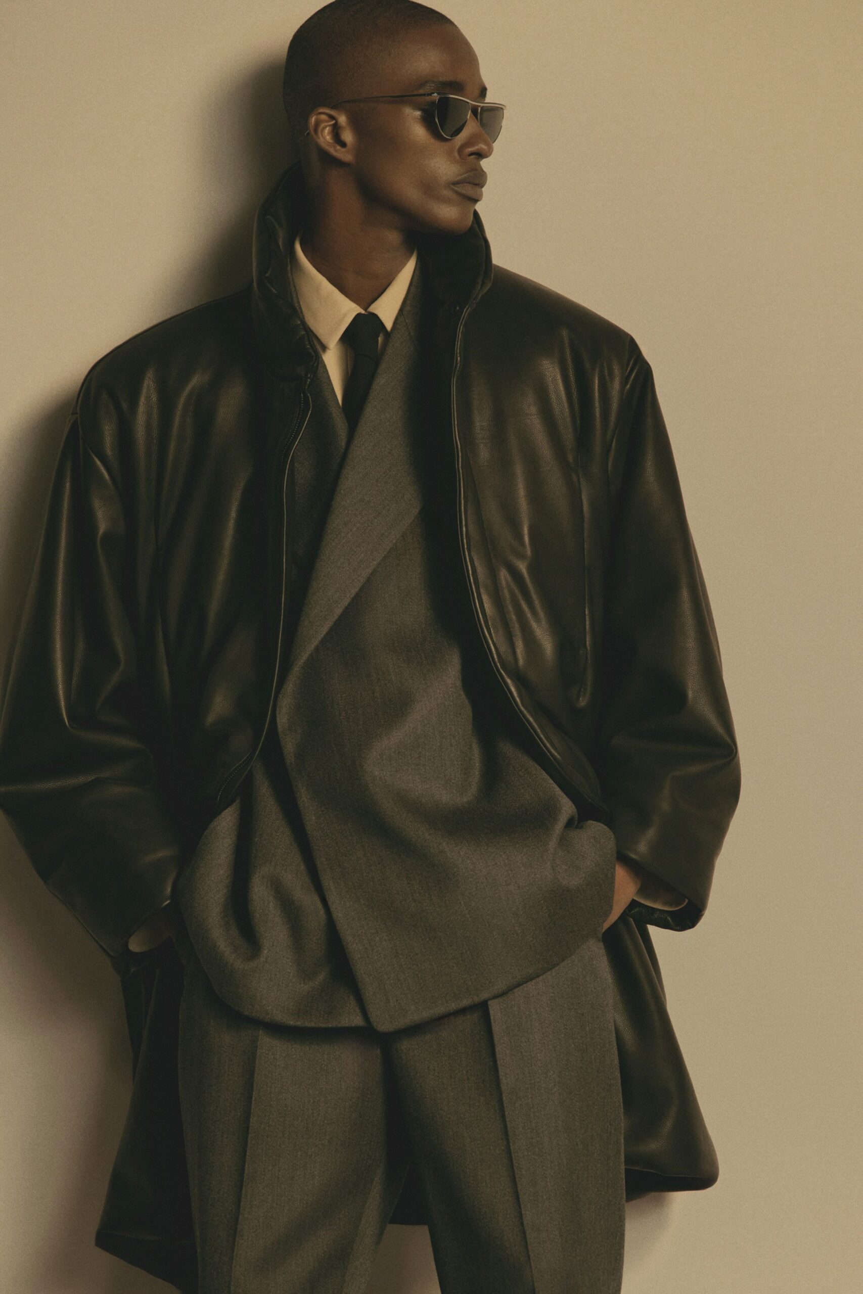 black leather coat gray suit