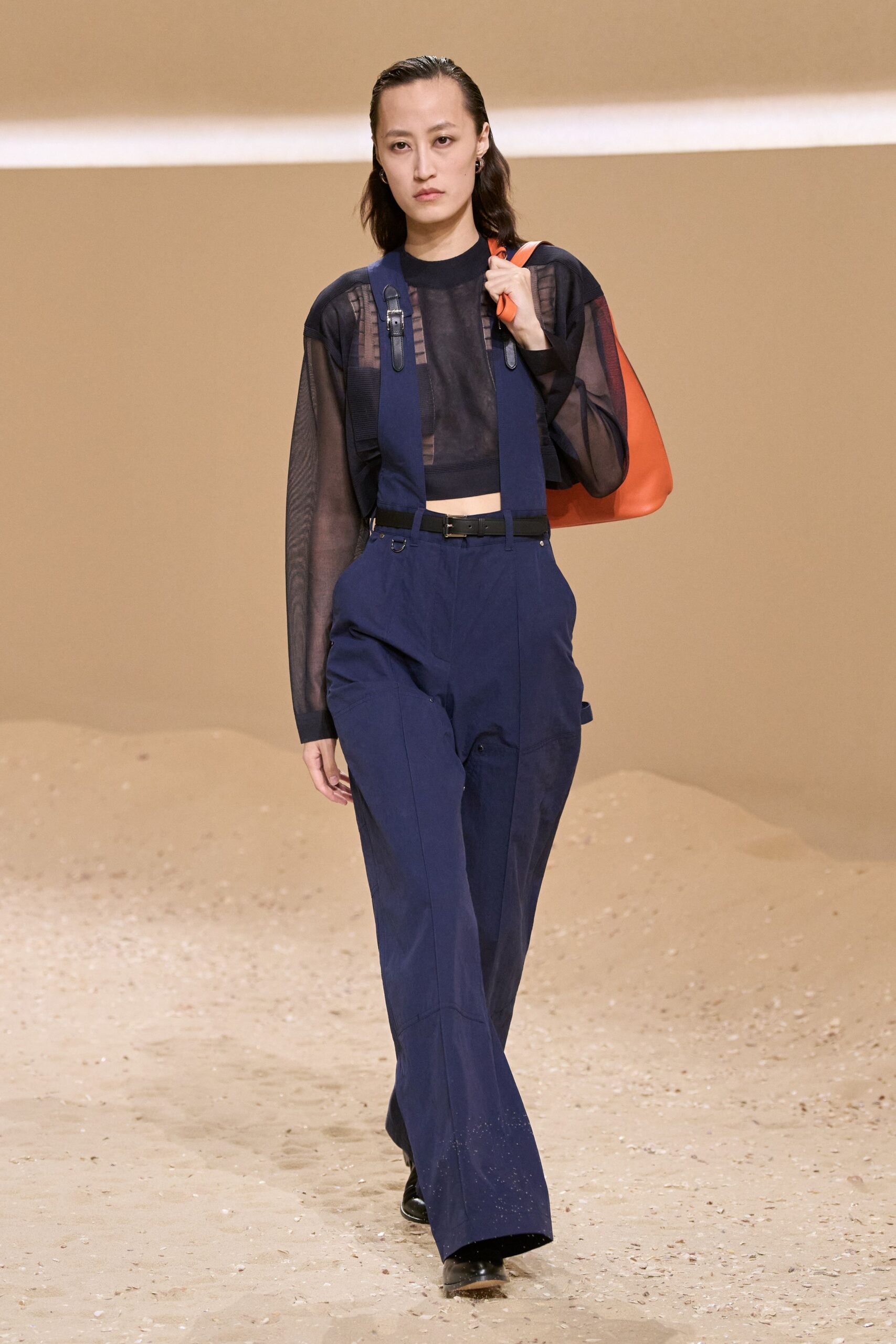 black mesh top blue pants
