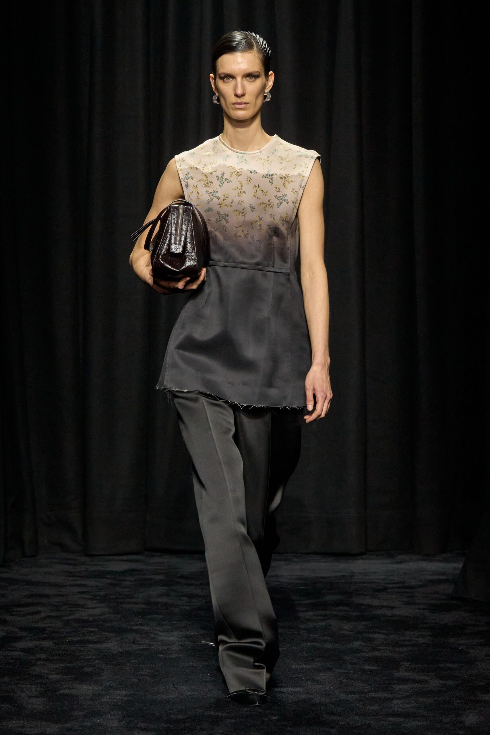 black silk sleeveless top with tailored pants