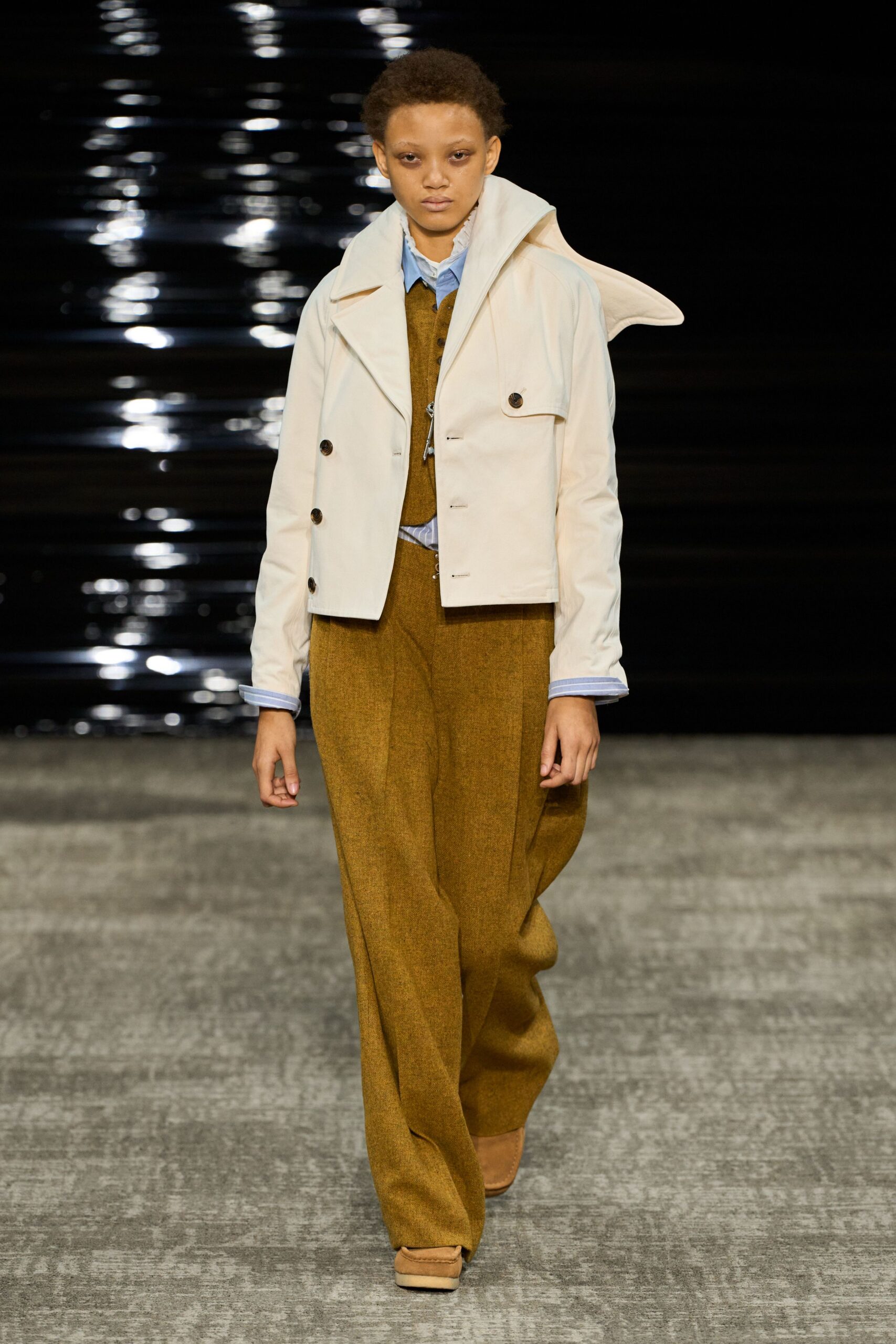white jacket blue shirt brown vest pants
