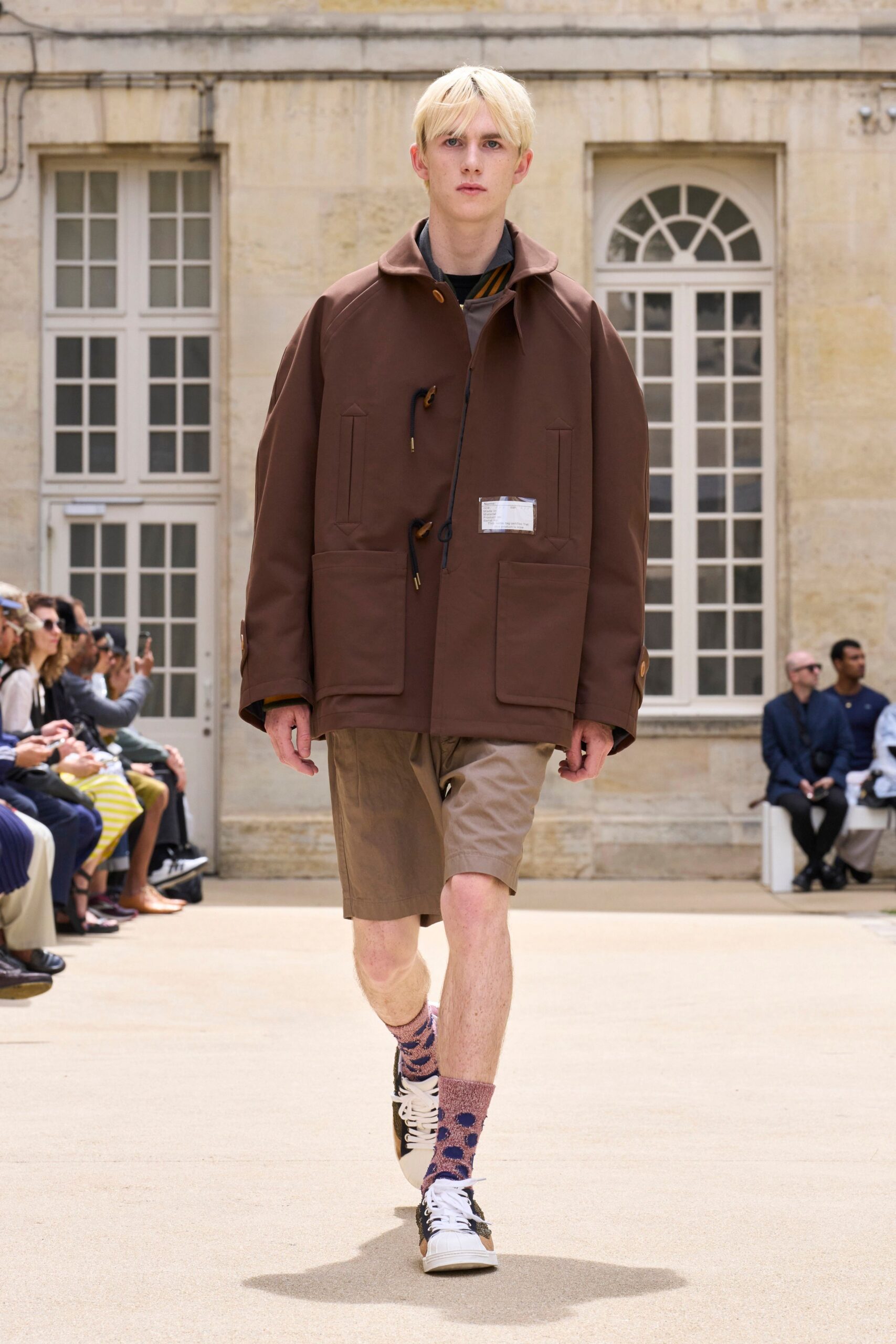 brown relaxed jacket with beige shorts