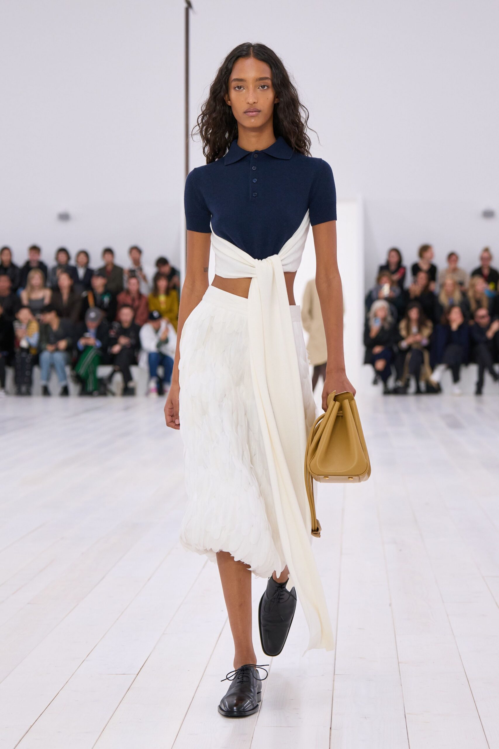 navy top white pleated skirt
