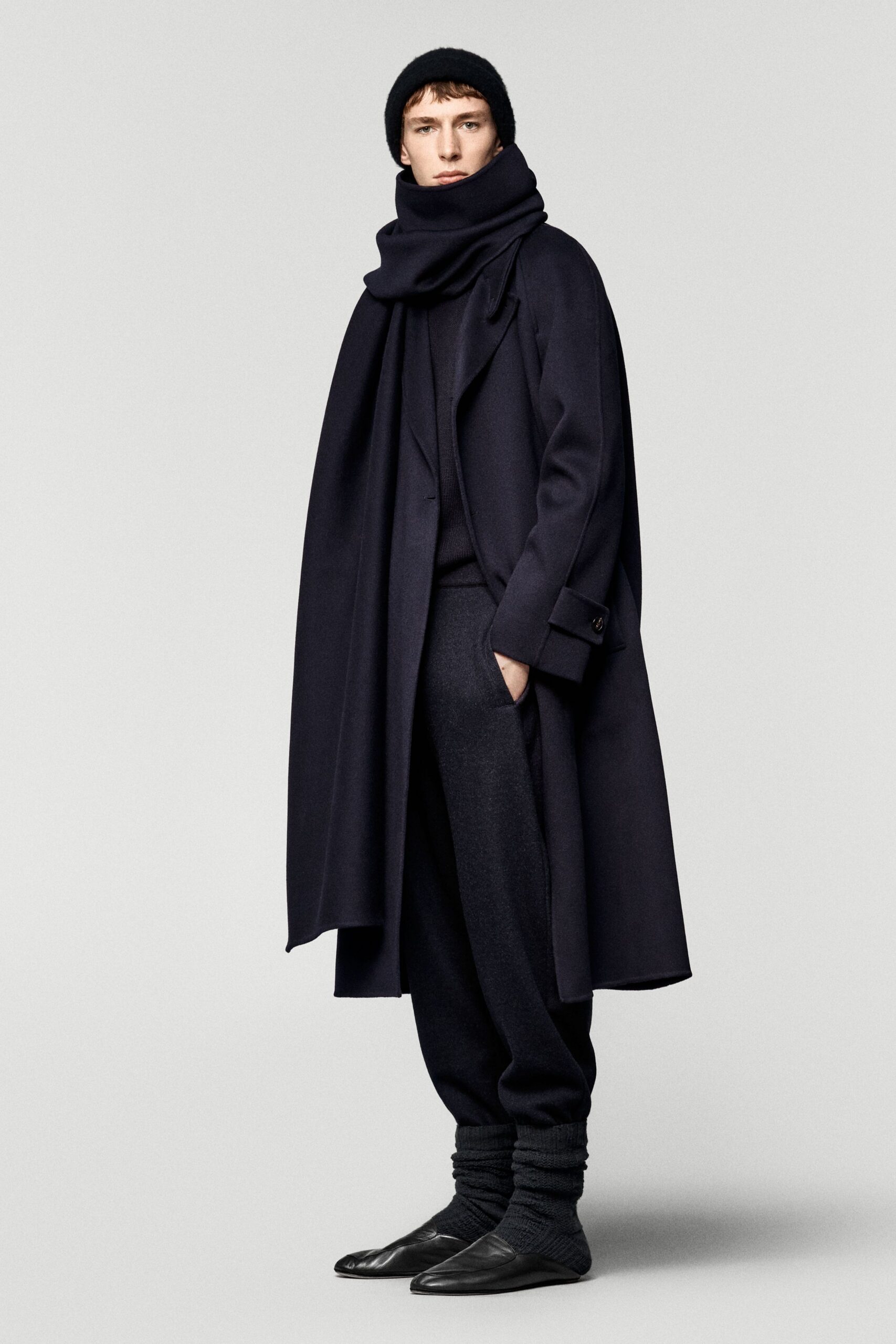 black wool long-sleeve collared relaxed draped coat