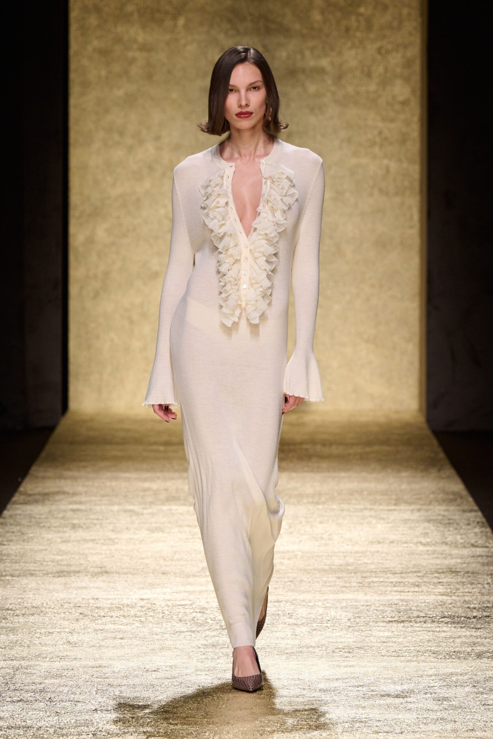 white fitted gown with ruffles