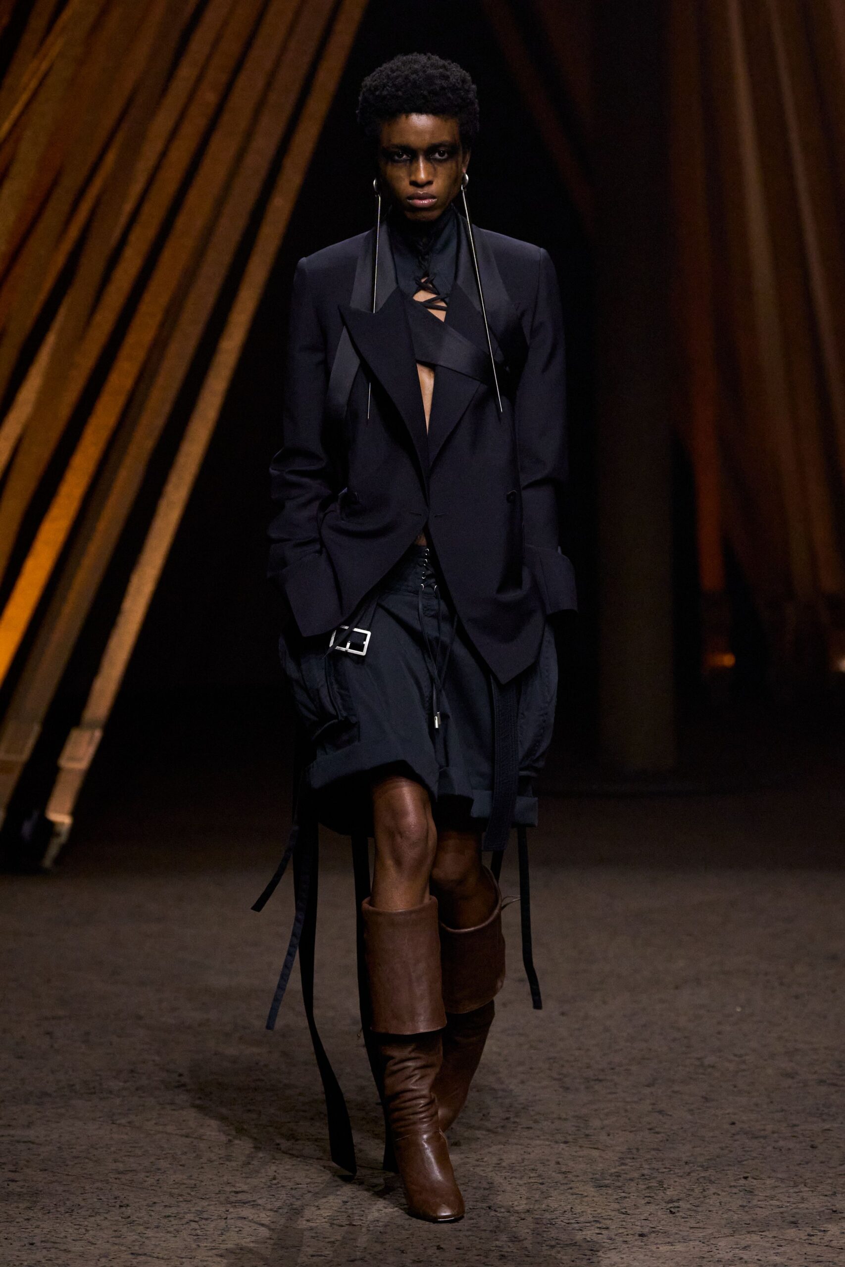 black blazer and skirt with brown boots