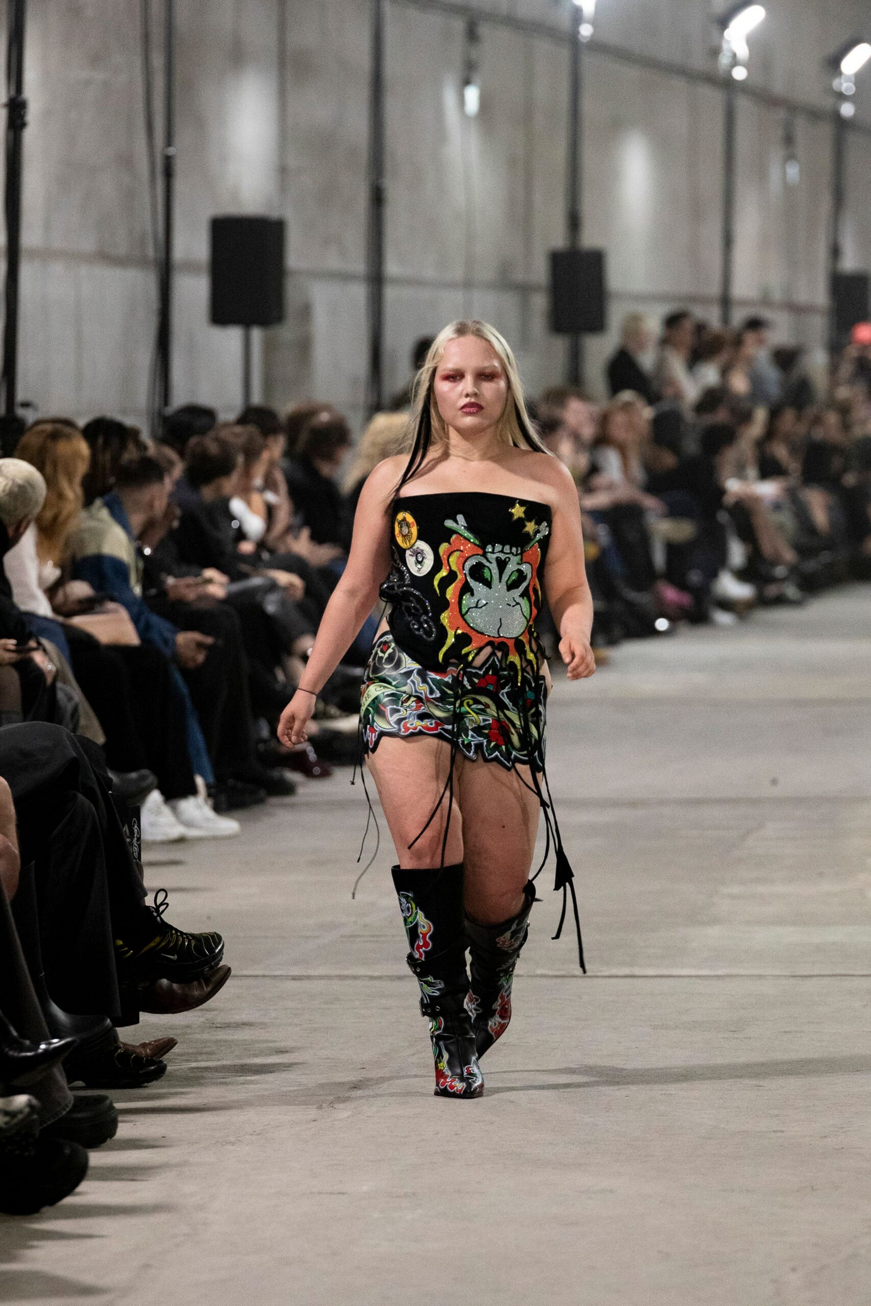 multi-colored embroidered mini dress with black boots
