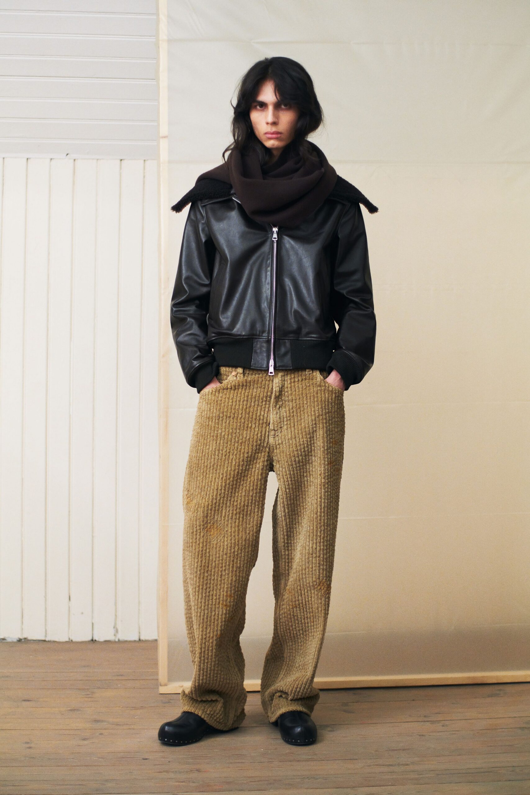 black leather jacket beige pants