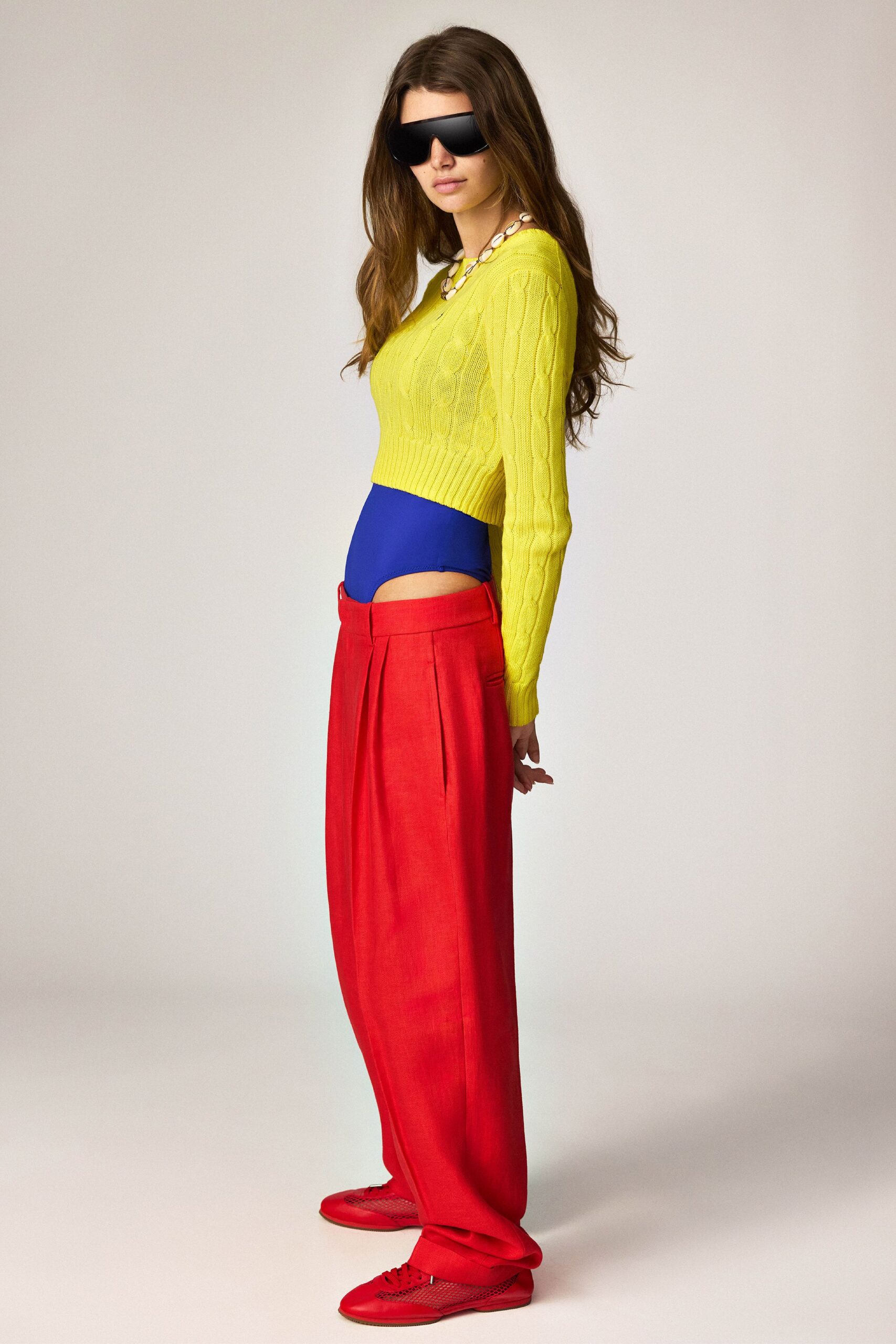 red linen relaxed high-waisted pleated pants