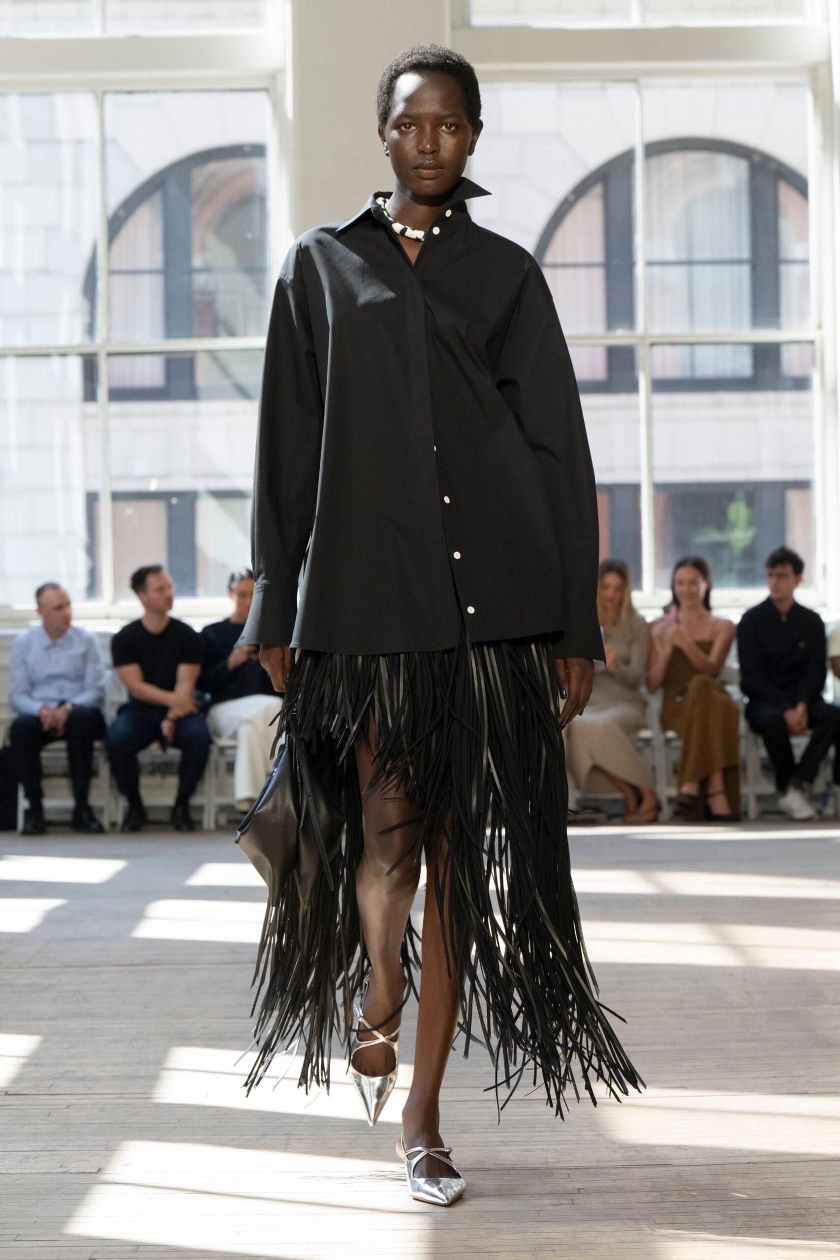 black shirt-dress with fringes