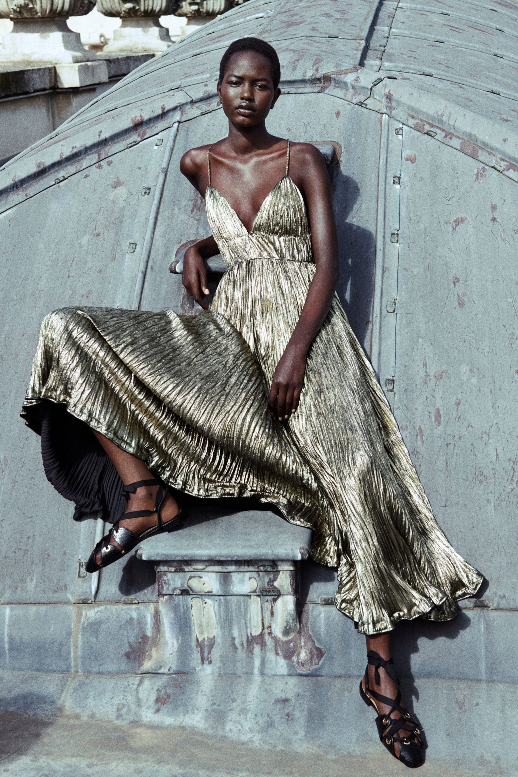 gold pleated midi dress with strappy shoes