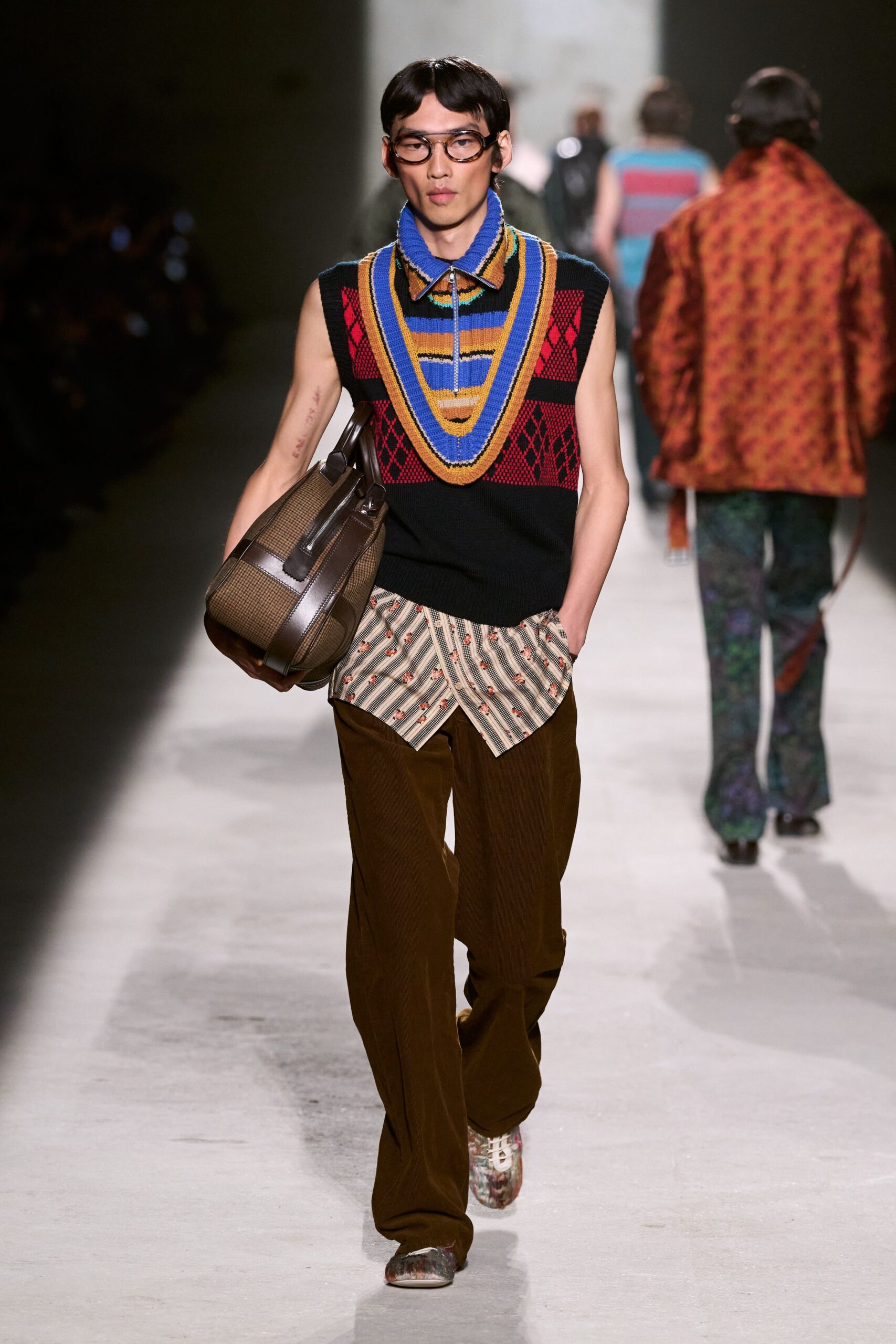 black and red sleeveless sweater with printed shirt