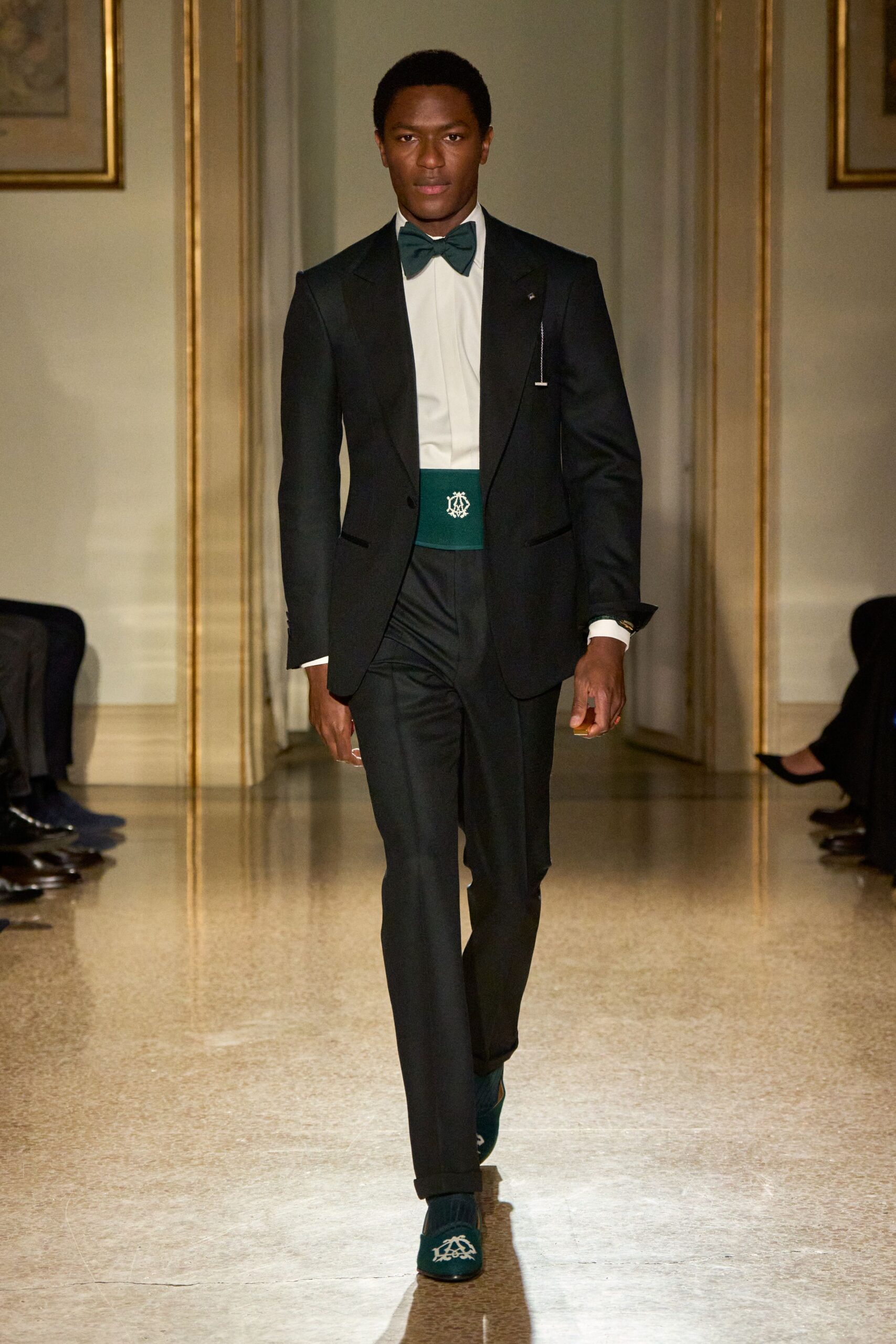 black tailored suit with green accents