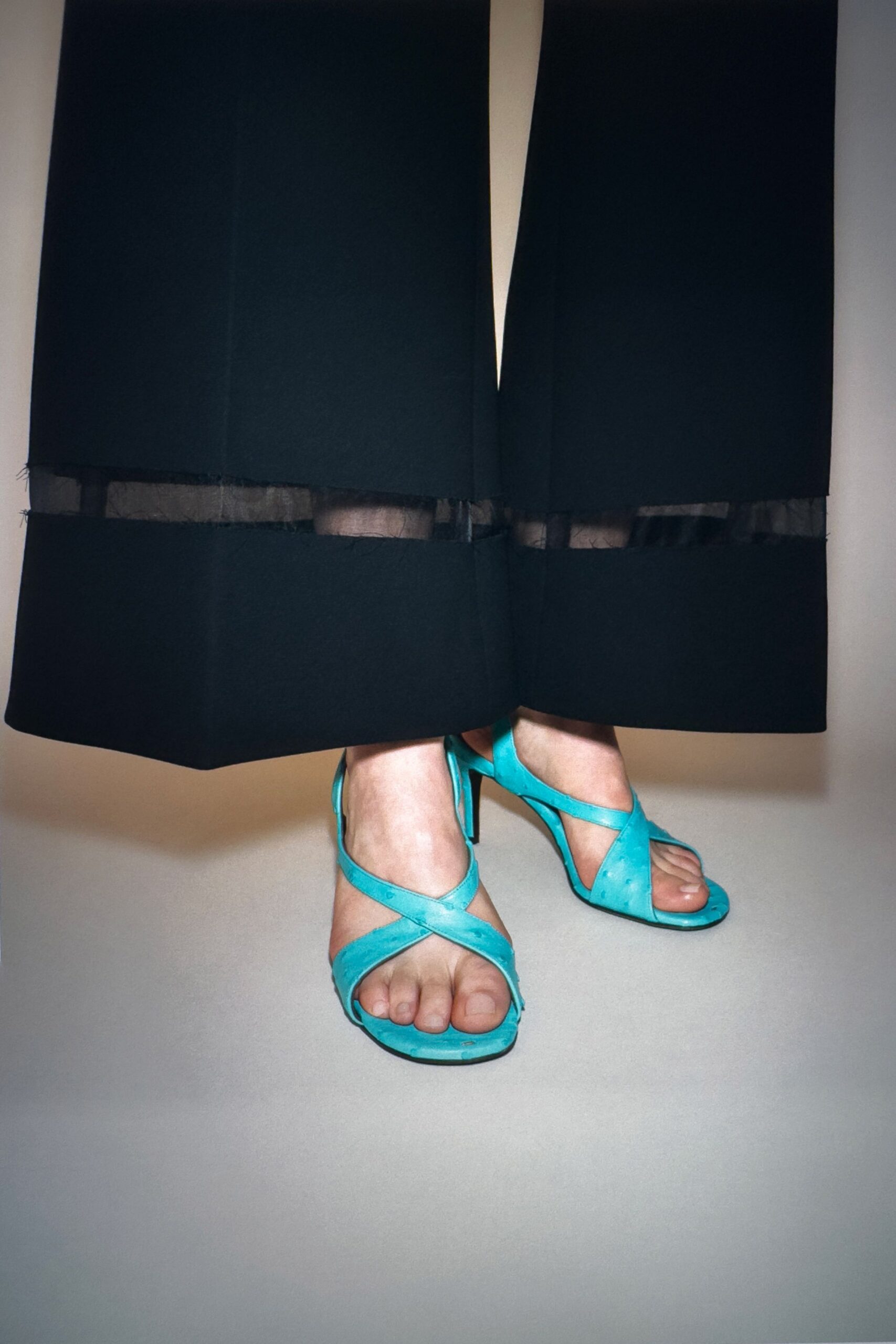 black fitted pants with blue shoes