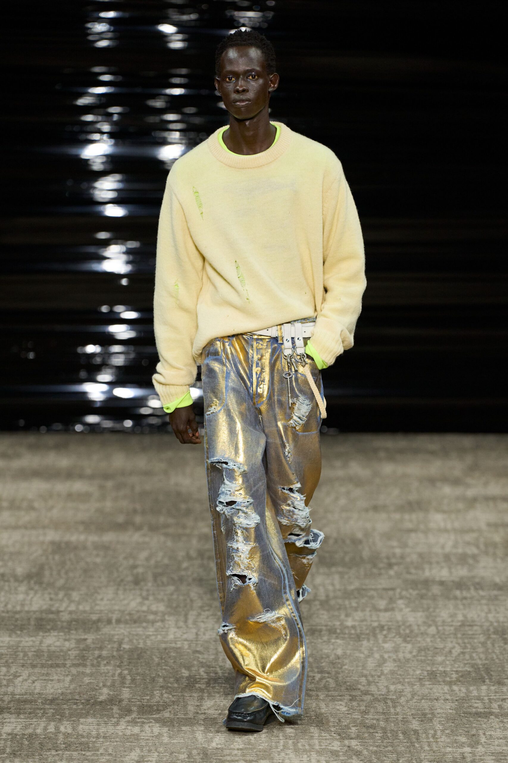 yellow relaxed sweater with distressed gold pants