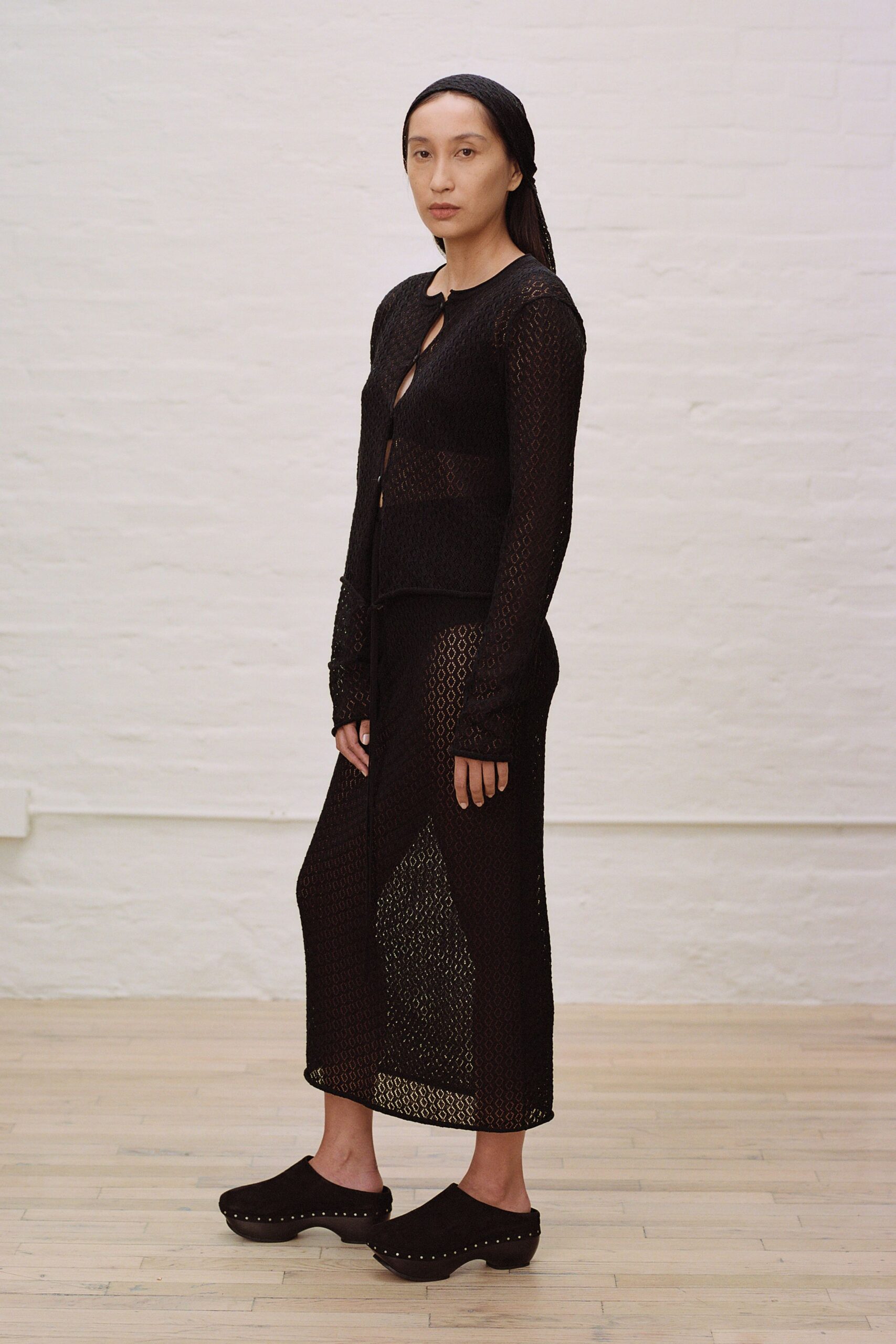 black knit sleeveless v-neck fitted straight-leg sheer dress
