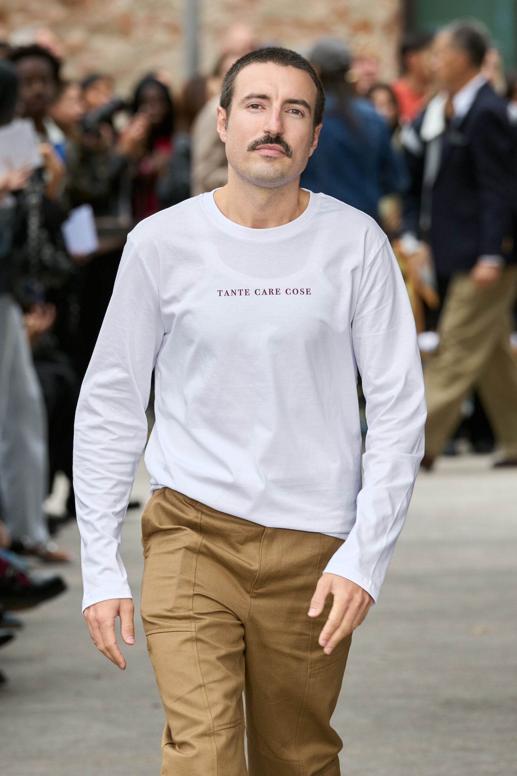white long-sleeve shirt and beige pants