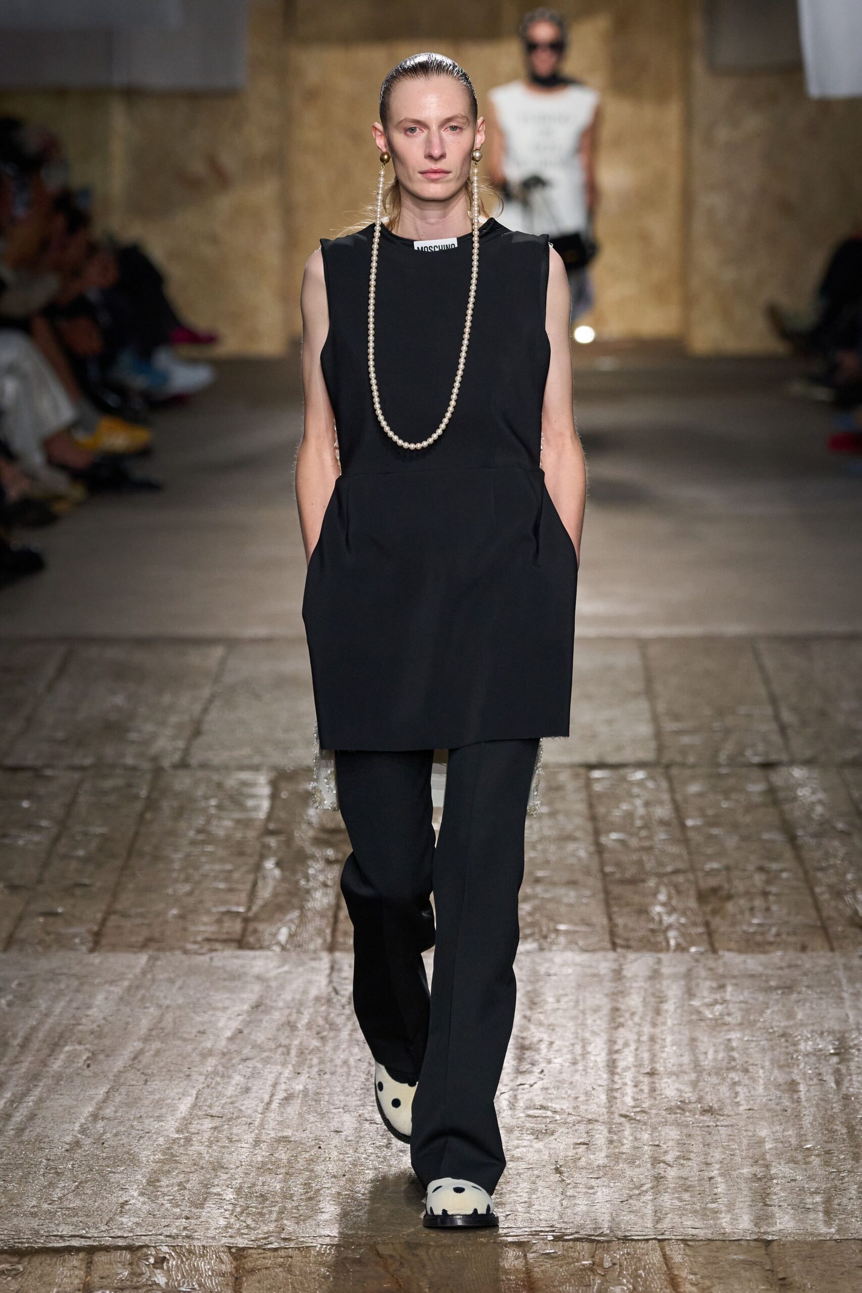 black sleeveless top with tailored pants