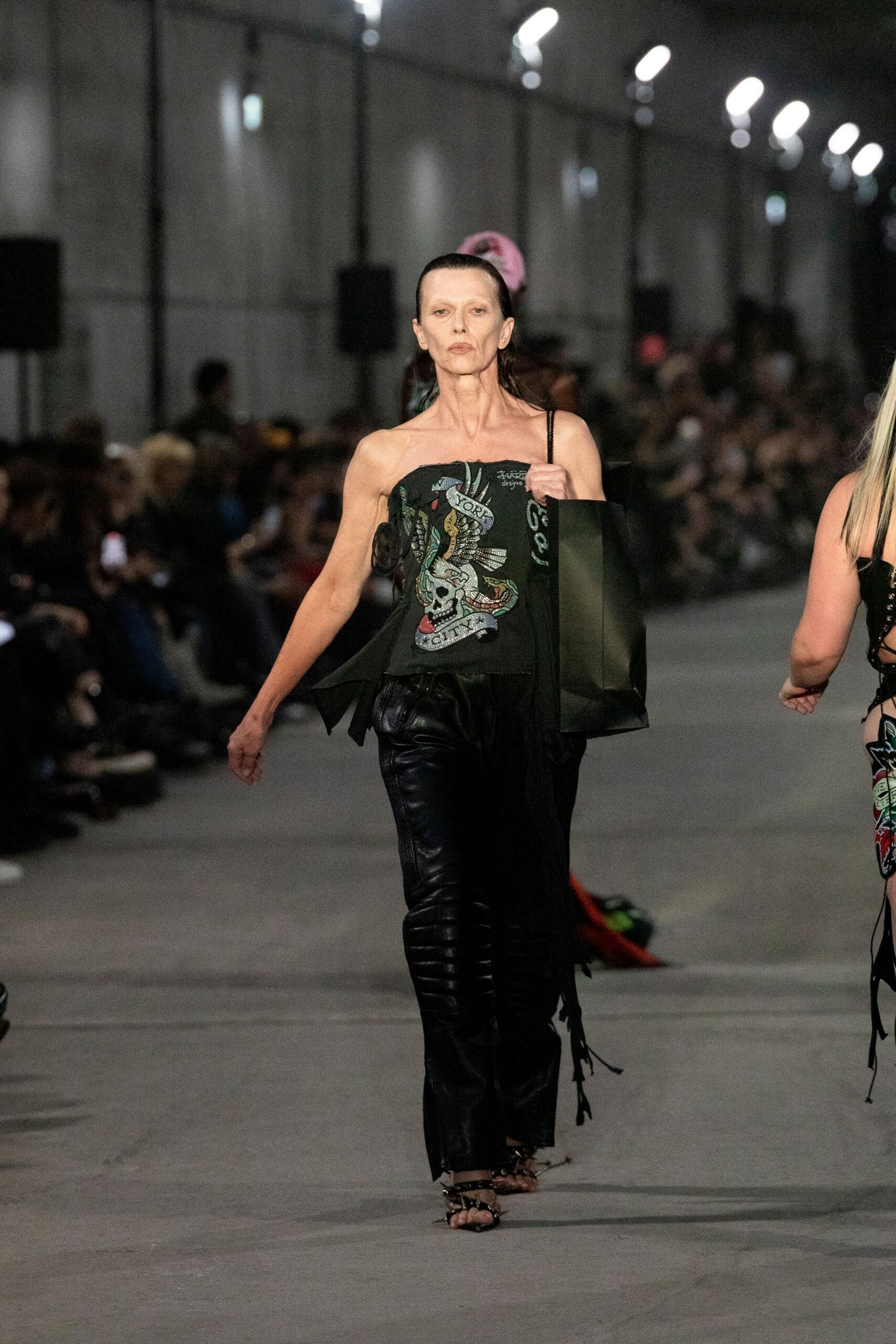 black embroidered top with leather pants