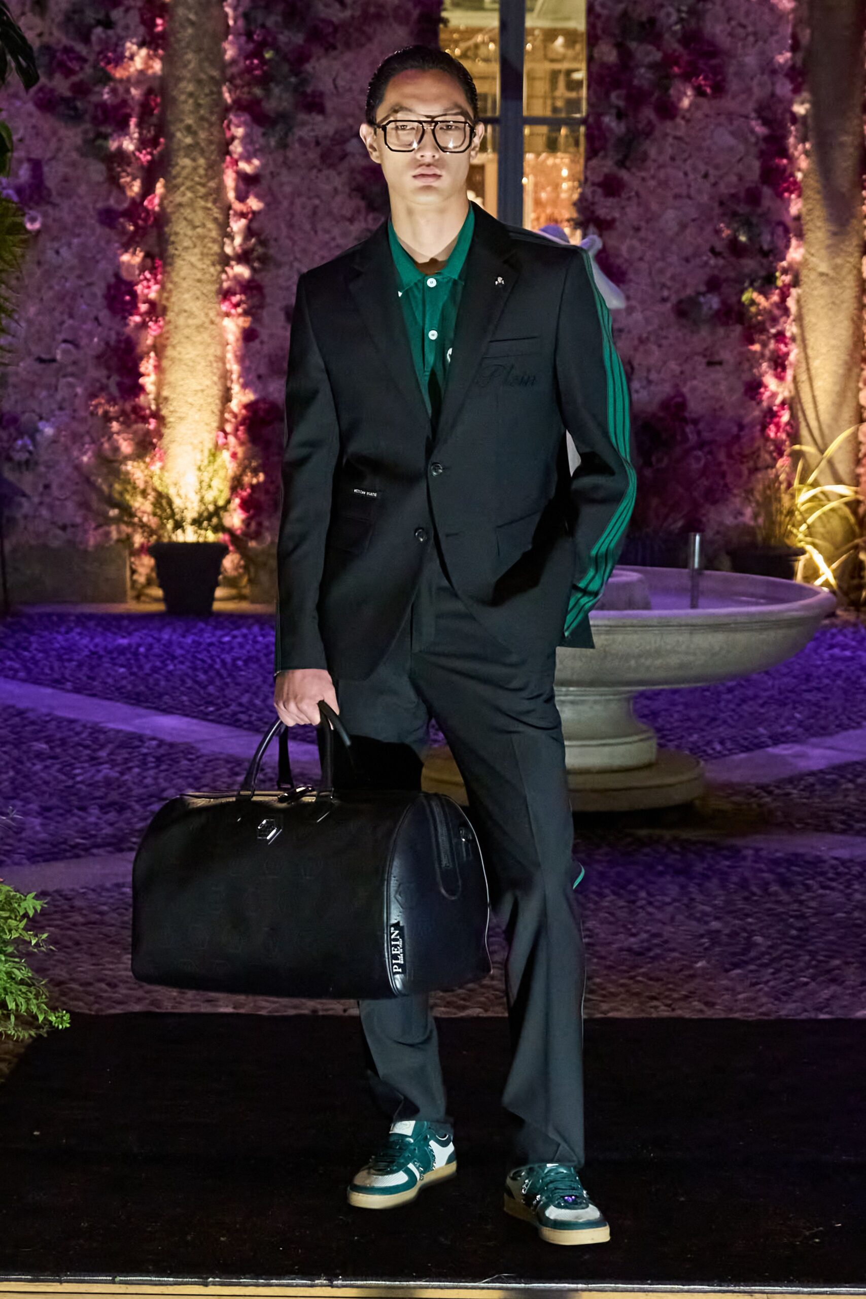 black tailored suit with green shirt