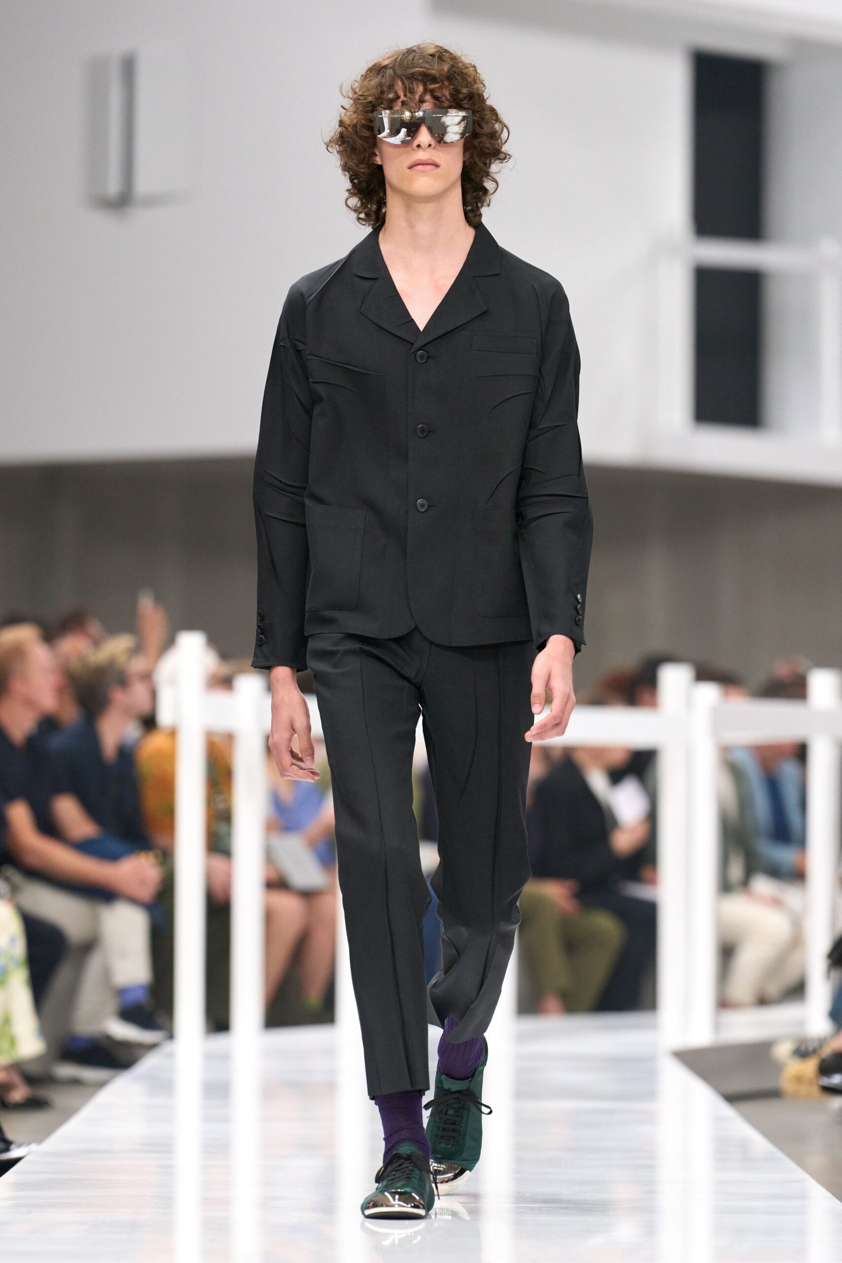 black tailored suit with sunglasses