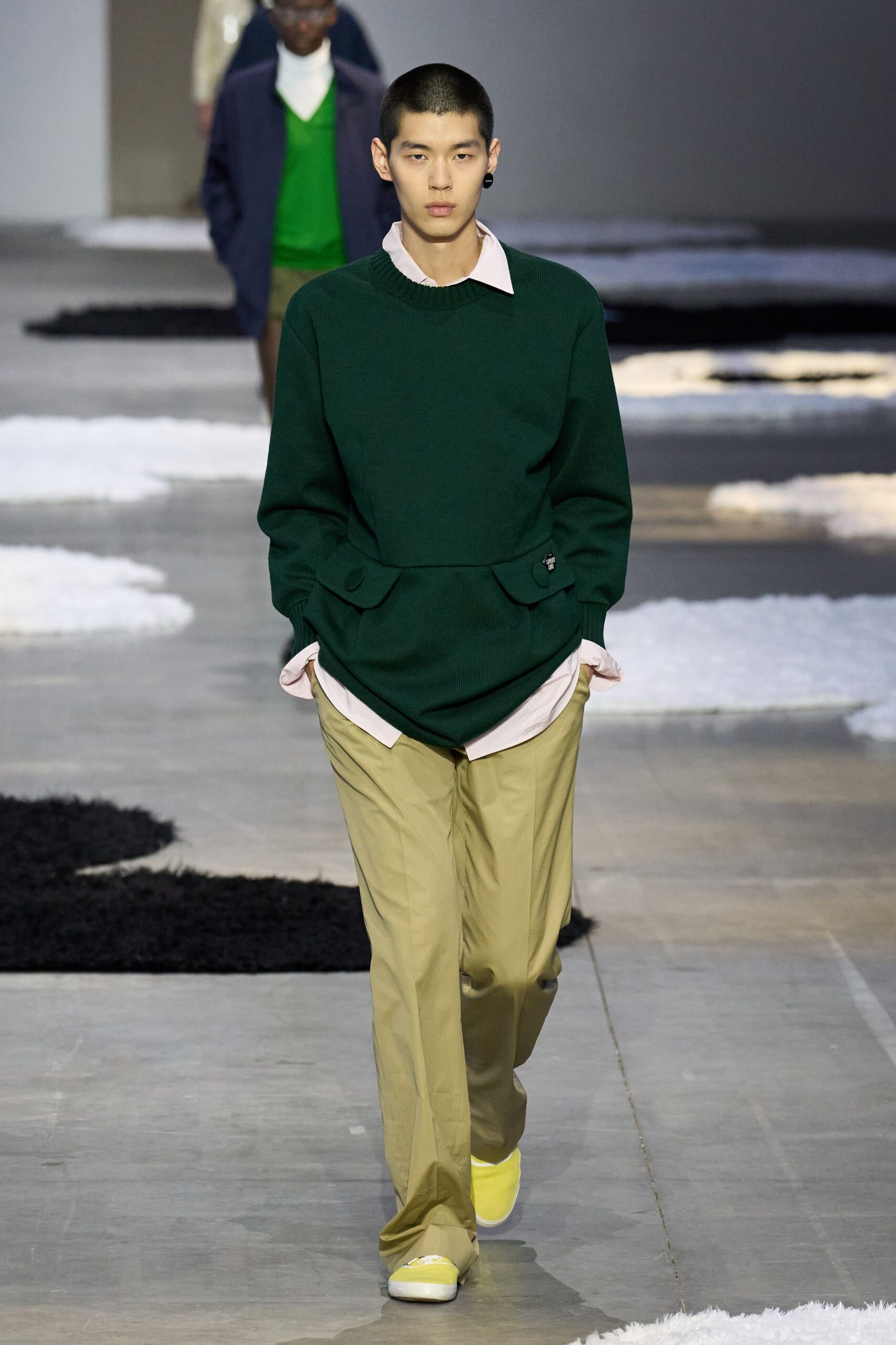 green relaxed sweater with beige pants