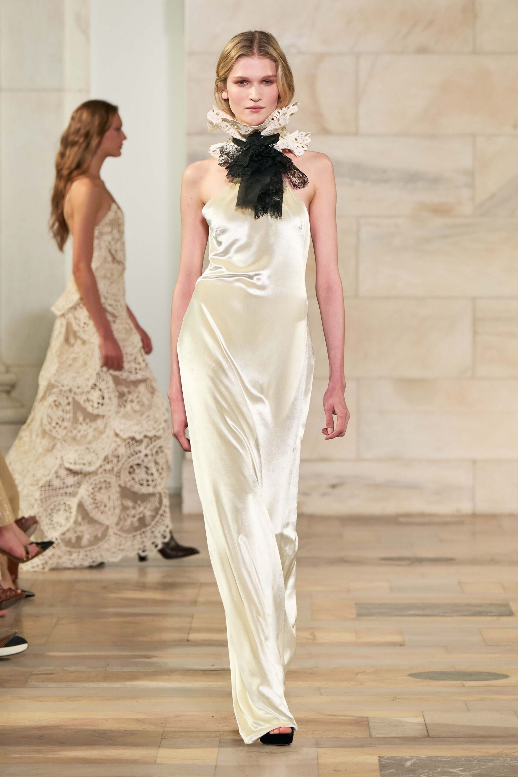 ivory silk sleeveless high-neck fitted draped flowing gown