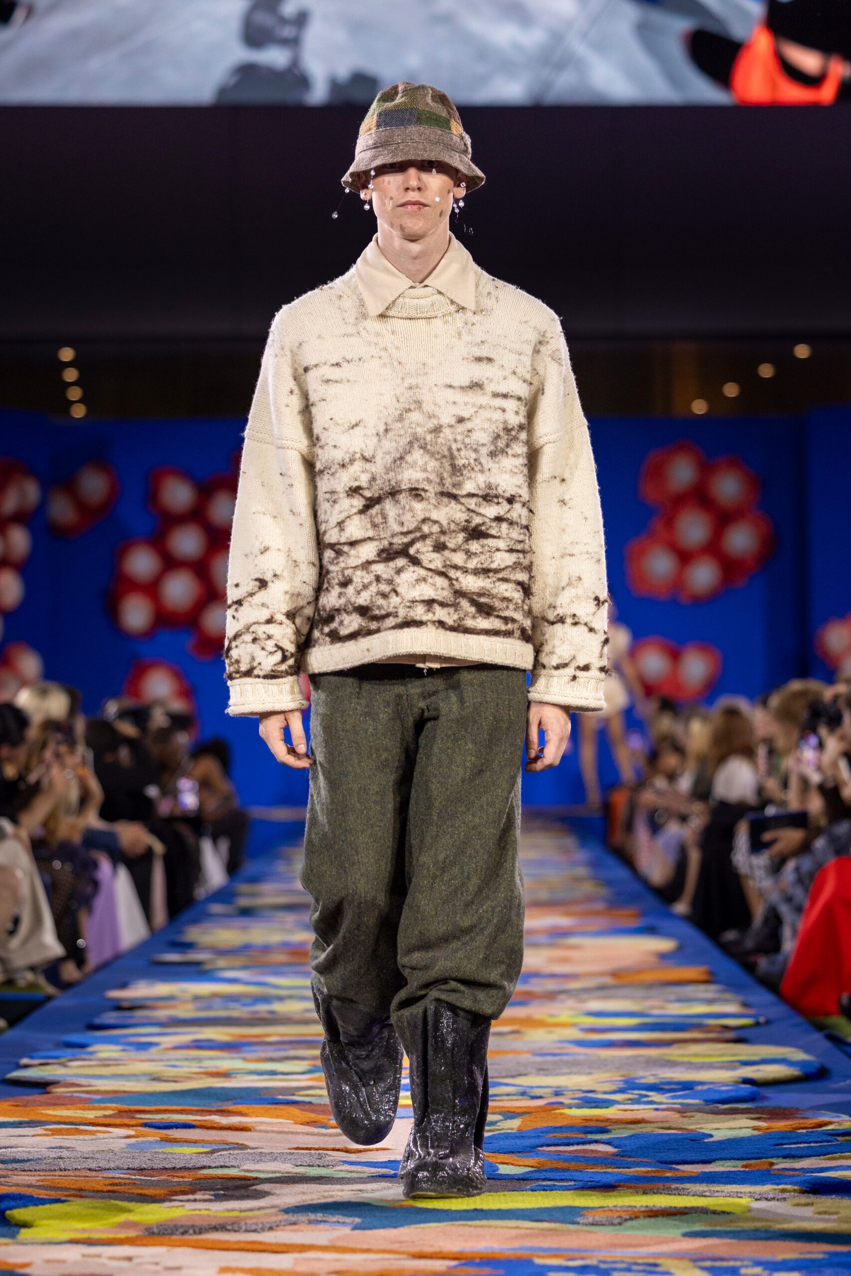 relaxed white and brown sweater with green pants