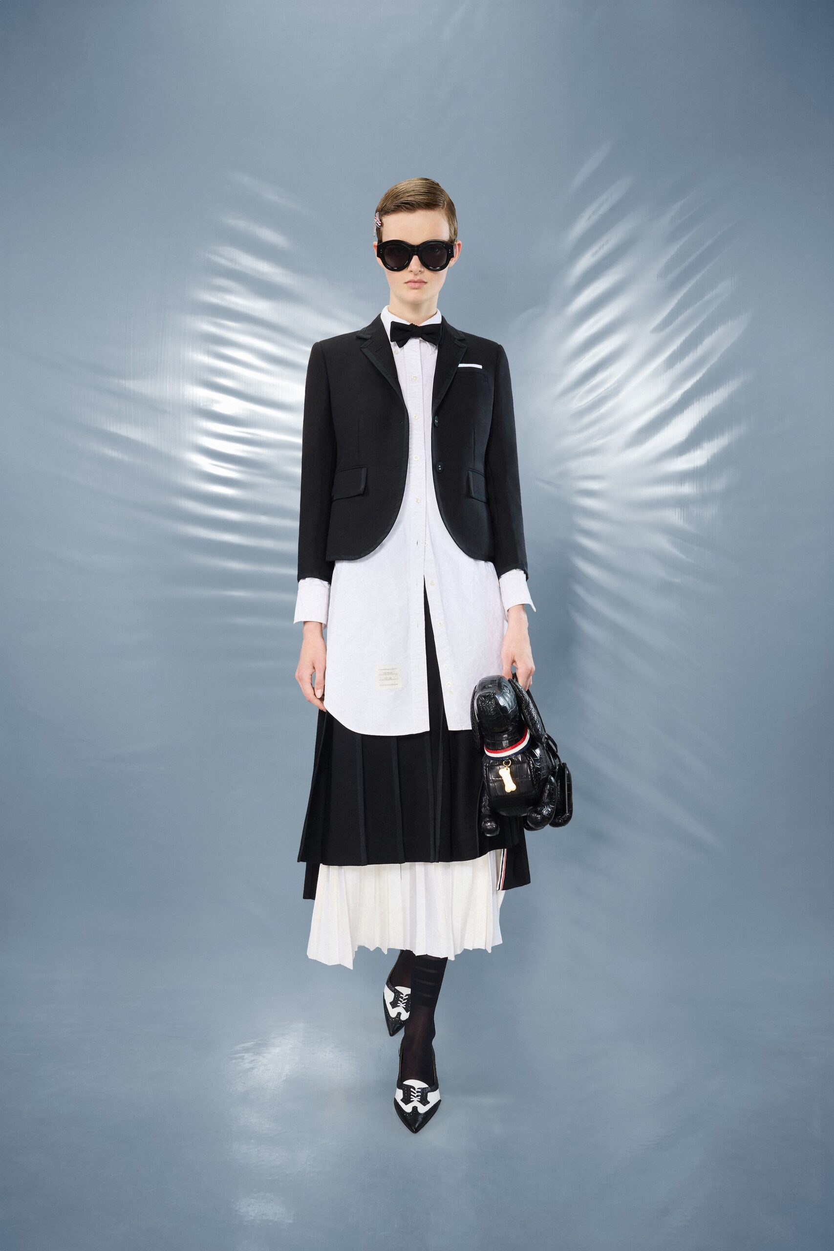 black tailored blazer with pleated skirt