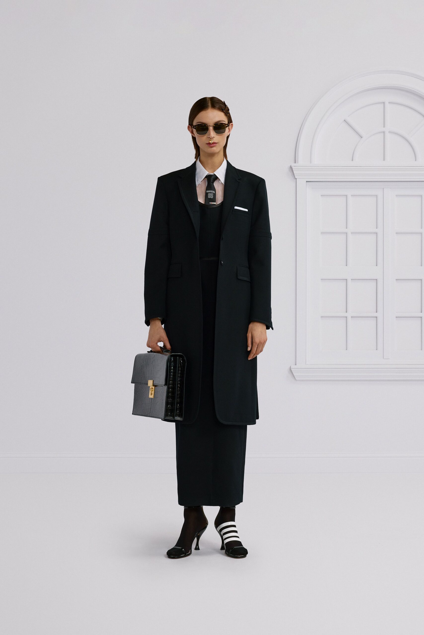 black tailored suit with sunglasses